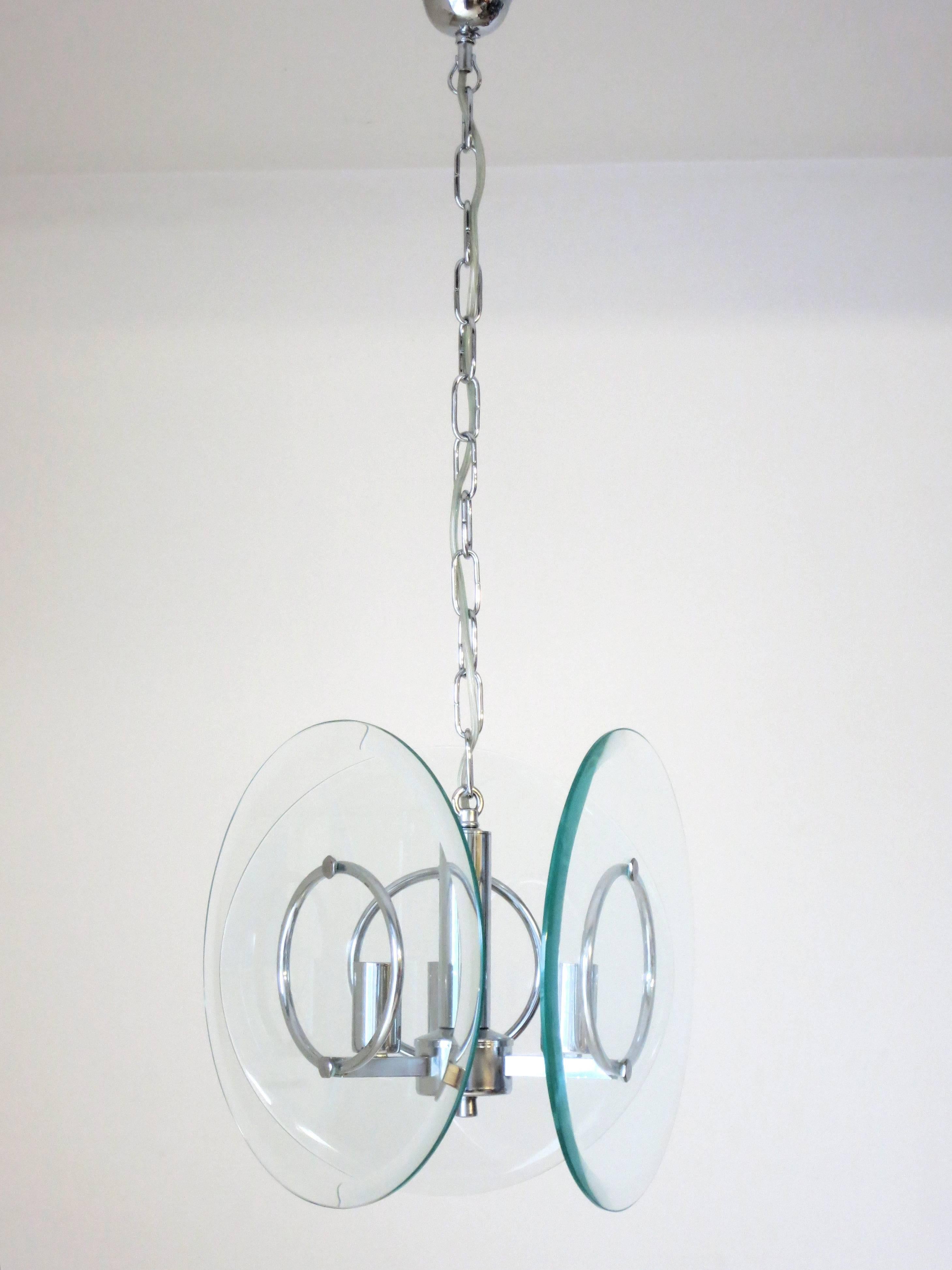 Vintage Italian pendant with three thick clear beveled glass disks, mounted on chrome frame / Designed by Cristal Art circa 1960’s / Made in Italy 
3 lights / E12 or E14 type / max 40W each 
Diameter: 10 inches / Height: 31.5 inches including chain
