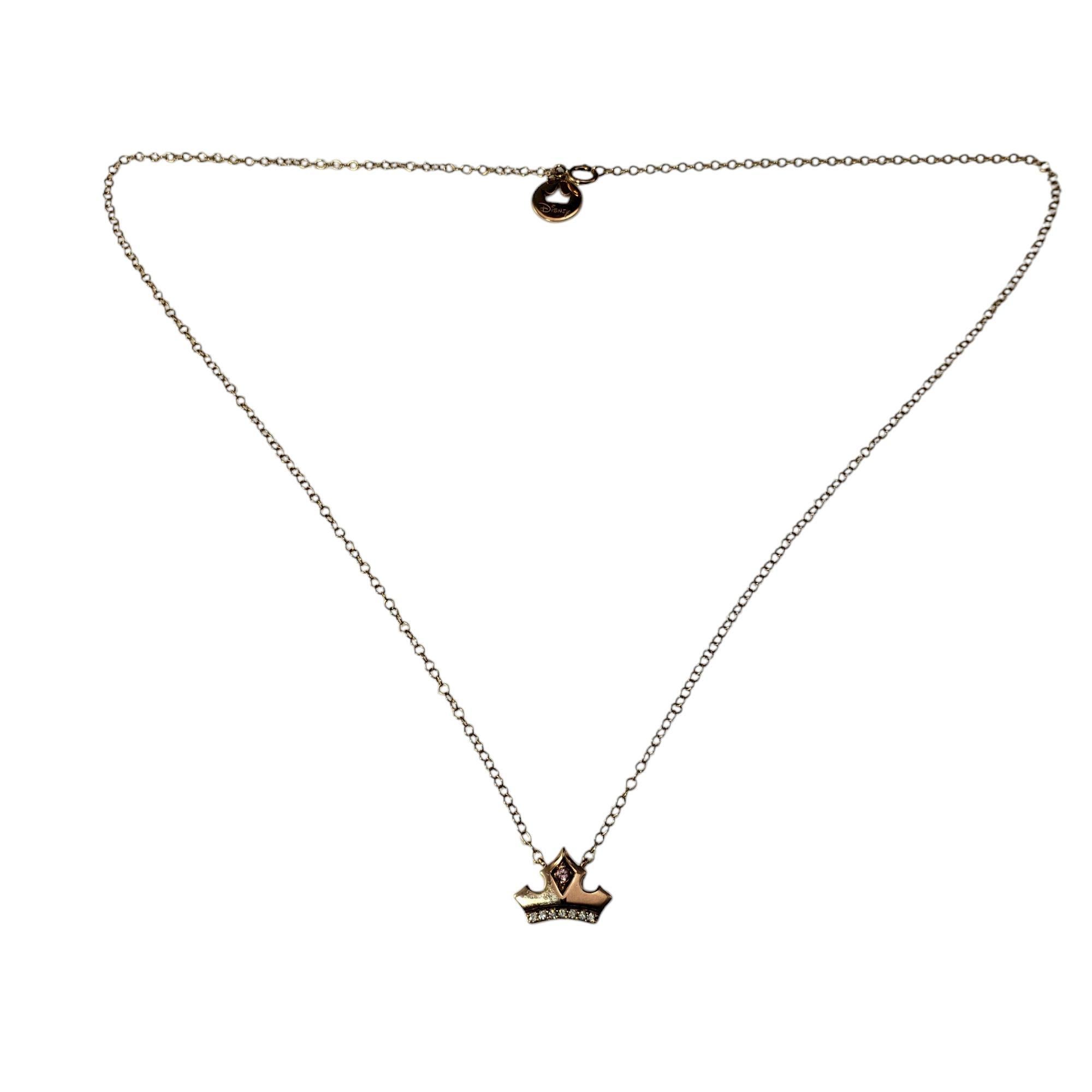 Disney 10K Rose Gold Pink Topaz and Diamond Aurora Crown Necklace

Inspired by the grace and beauty of Disney princess Aurora, this exquisite necklace features a delicate crown adorned with seven round brilliant cut diamonds and a vibrant pink topaz