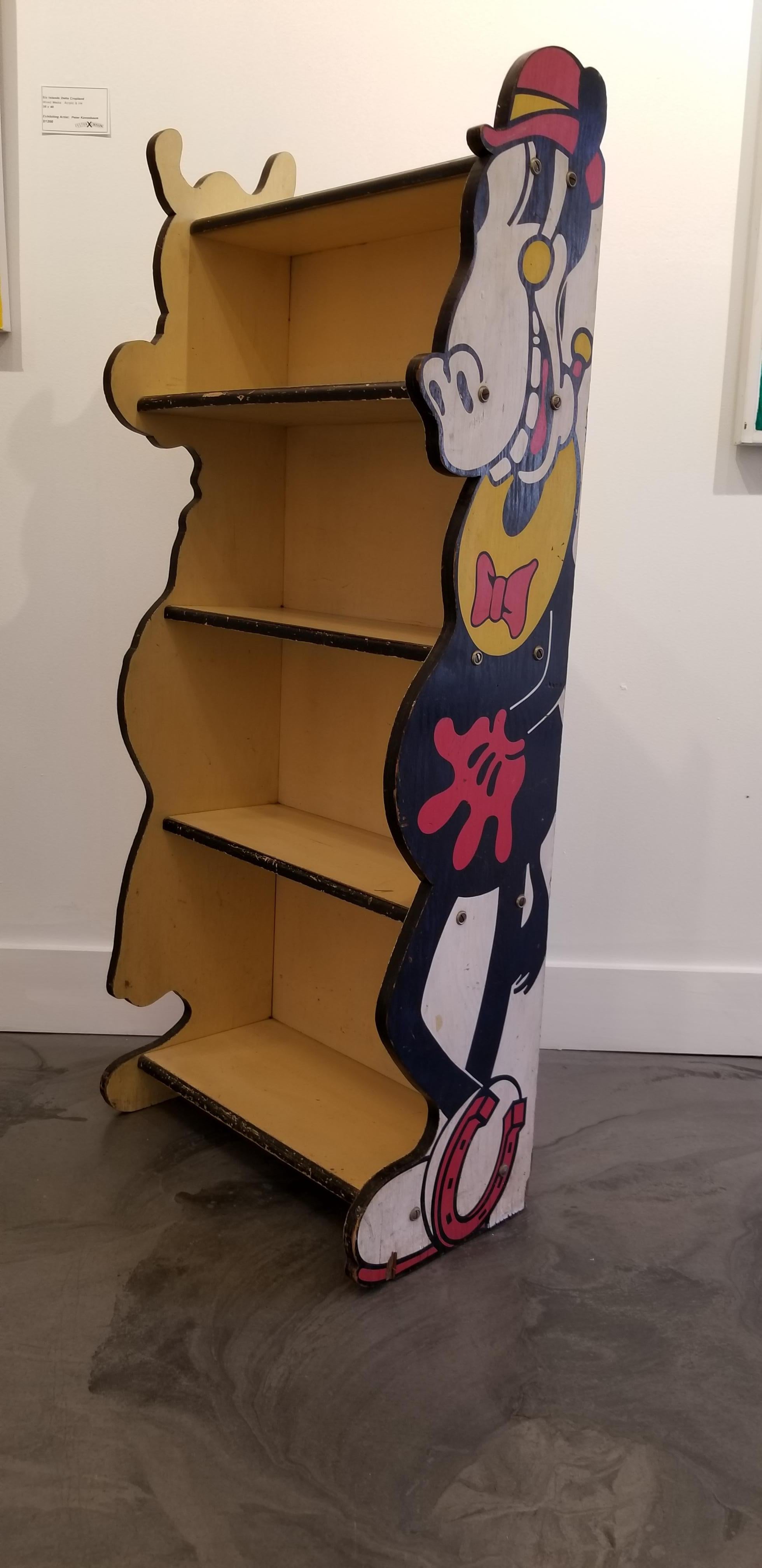 A rare hand painted bookshelf licensed by Walt Disney Productions and manufactured by Kroehler Mfg. Co., circa 1935-1955. Sides feature full body depictions of Horace Horsecollar and Clarabelle Cow. Original condition and original paint with some