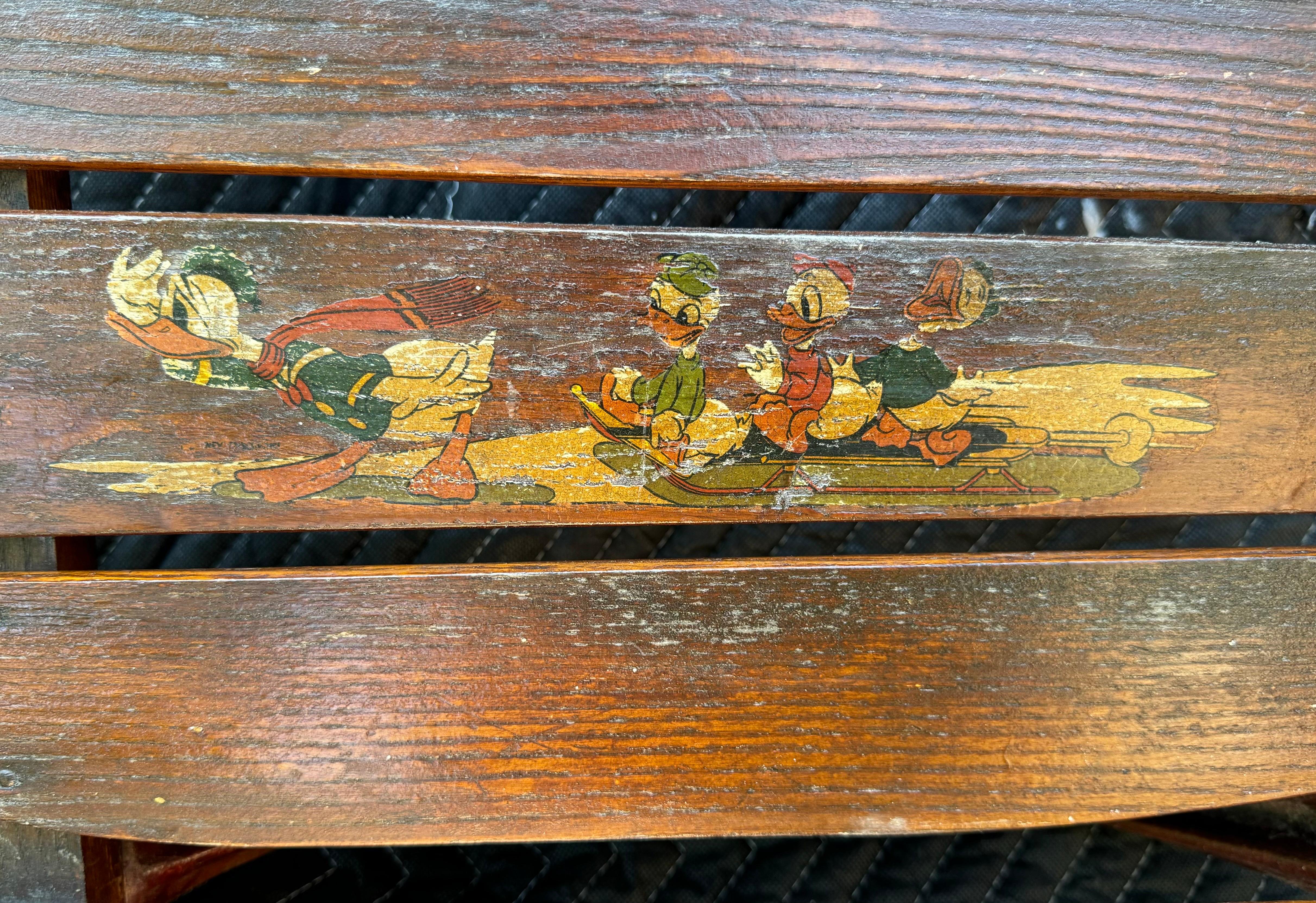 Disney Donald Duck Flexible Flyer Sled

1930's. It was made by 'S. L. Allen & Company, Inc., Philadelphia, Pa, Manufacturers of Flexible Flyer Sleds and Plant J Farm and Garden Tools' (see photo as this is on the bottom/underneath). The S.L. Allen