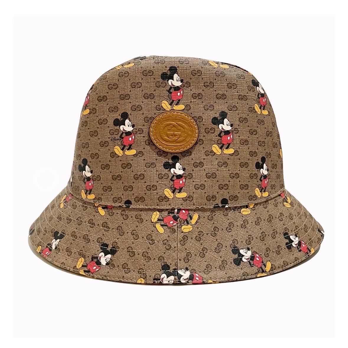 Mickey Monogram Bucket Hat by Disney X Gucci
Spring/Summer 2020
Made in Italy
Brown with vintage Gucci monogram throughout 
Mickey Mouse graphic intermixed throughout 
Interlocking G Gucci logo stamped on leather patch 
Fabric Composition; 50%