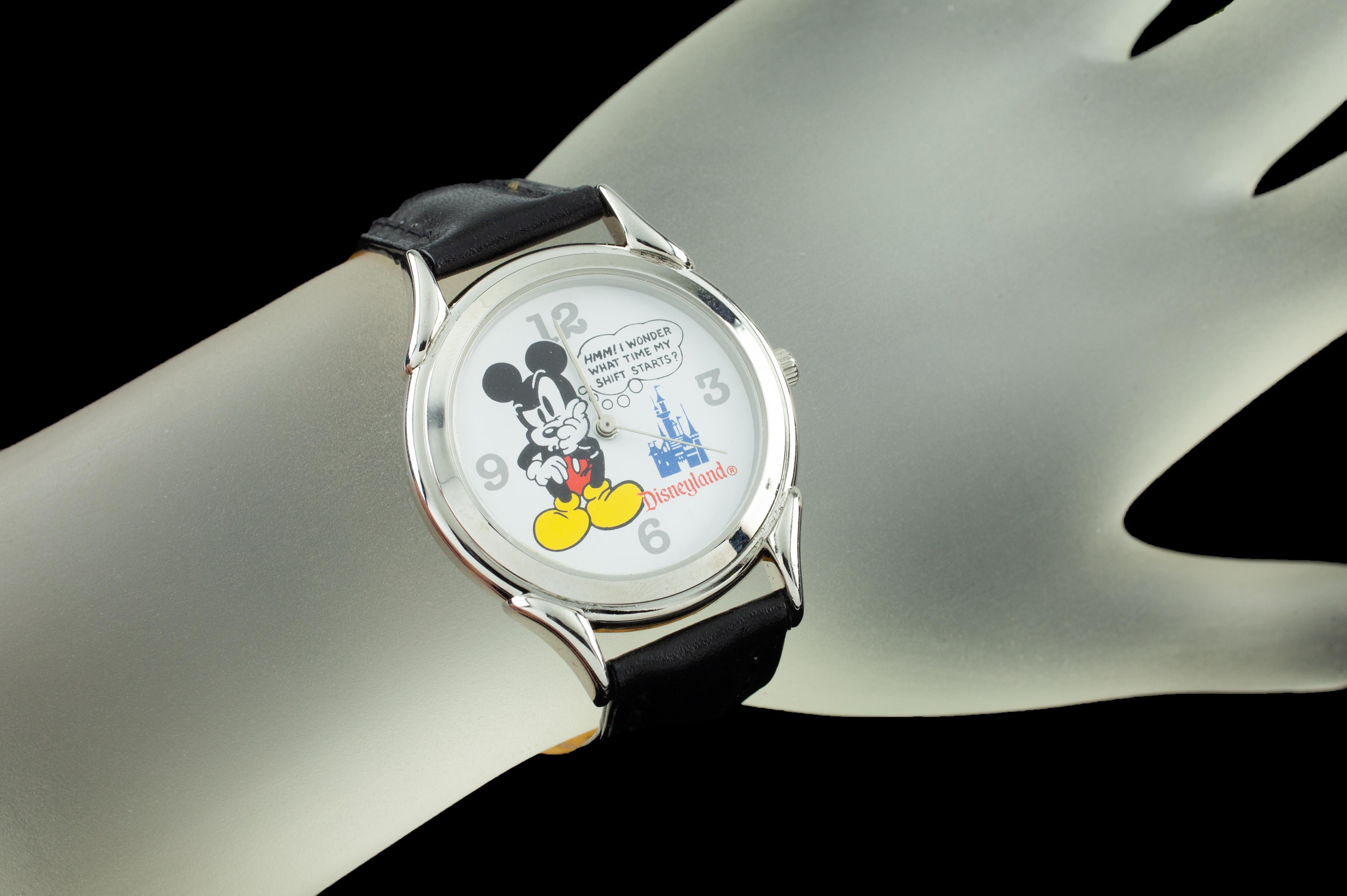 Disneyland stainless steel watch.
Only given to Disney employees at the park.
Features a quizzical Mickey Mouse with a thought bubble, 