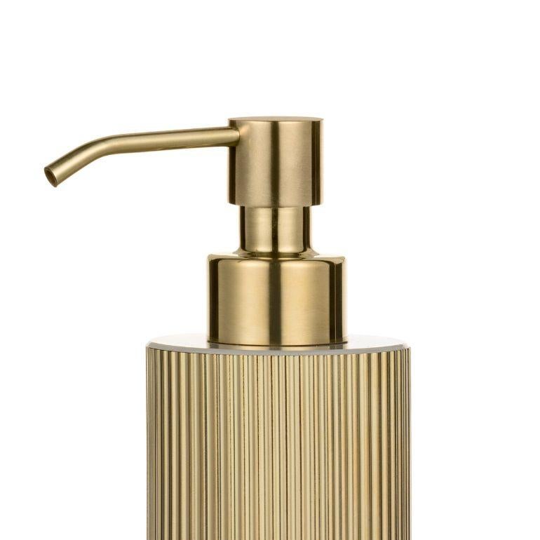 Enhance the style and functionality of your bathroom with our fluted brass soap dispenser. Made of high-quality brass, this dispenser is durable and attractive and provides a practical solution for dispensing soap. The ribbed design and attractive