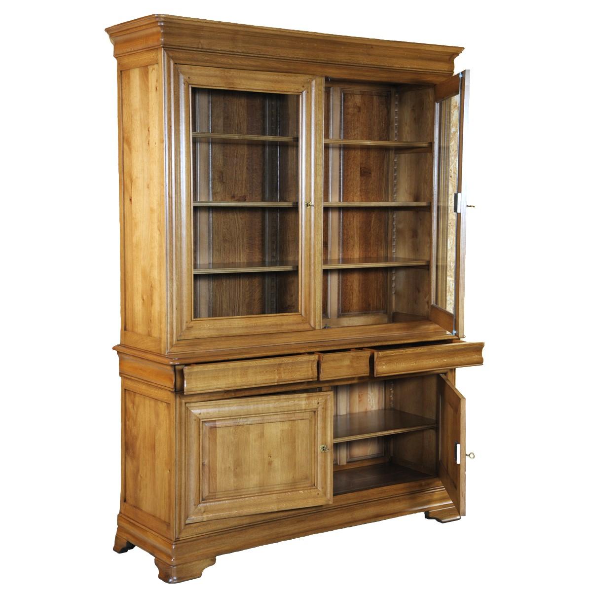 This bookcase is a hand made reproduction of a bookcase from the Louis-Philppe periode in France in the mid 19th century.
It is caracterized by its curved moldings, hand-curved feet and rounded smooth design.
This model features  doors and 2 bodies