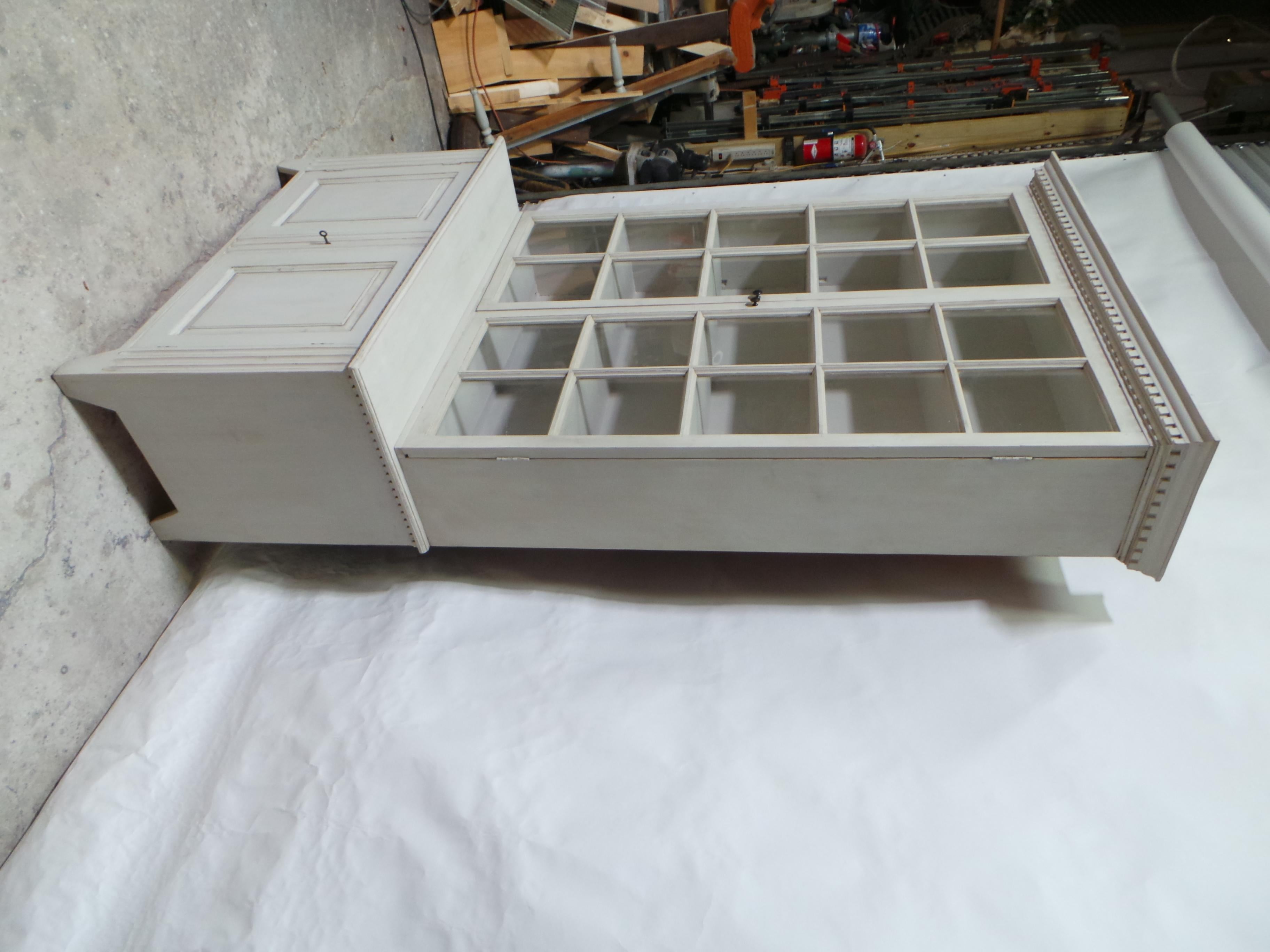 This is a unique 2 glass door top, 2 door bottom Gustavian style display case.
  the Bottom cabinet is circa 1950, the upper cabinet is New made using 150 year old Antique windows found at an Estate Auction in Leksand, Sweden.