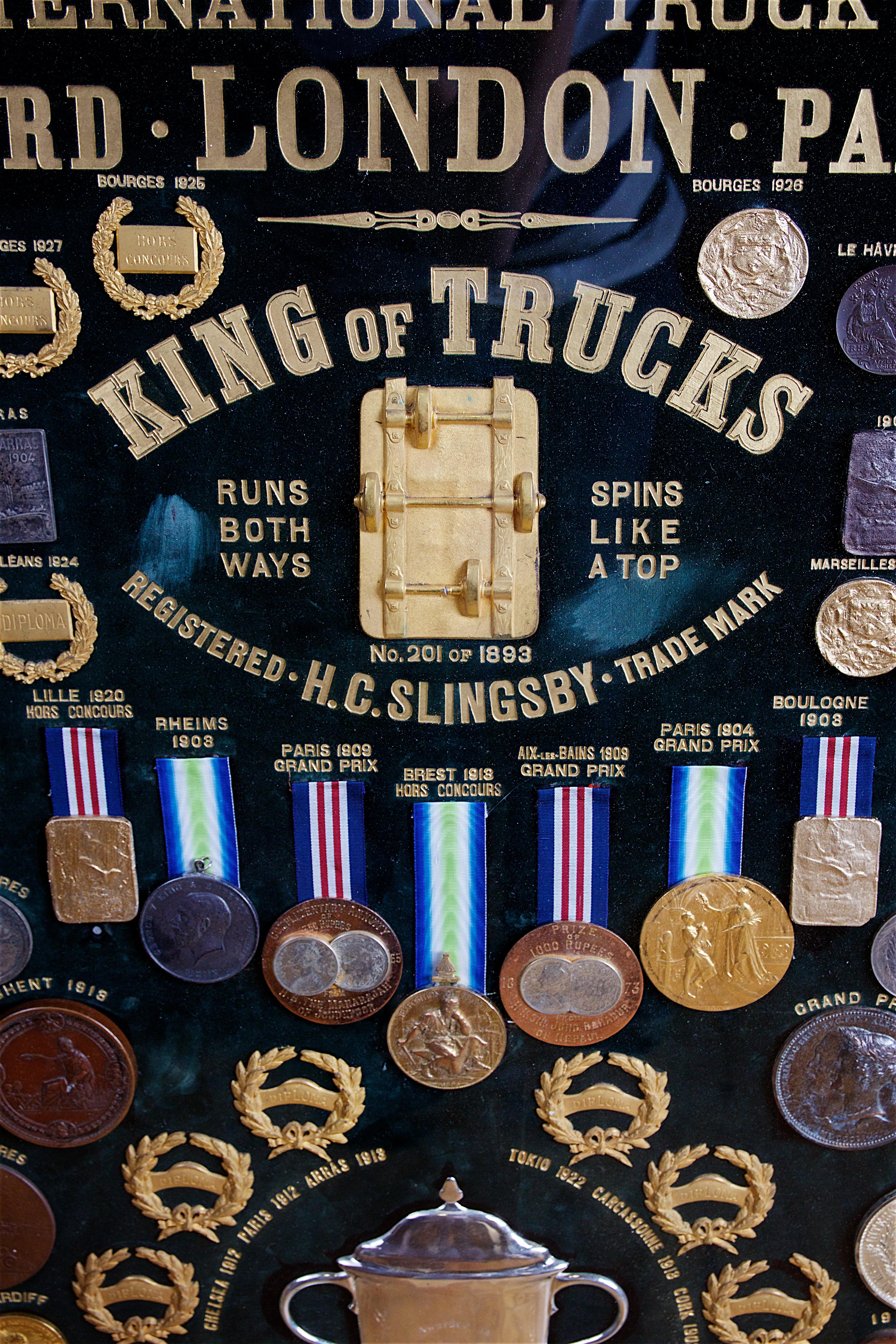 Display of Medals from H.C. Slingsby Truck Company, Set in Large Oval Frame In Good Condition For Sale In Stratford upon Avon, GB