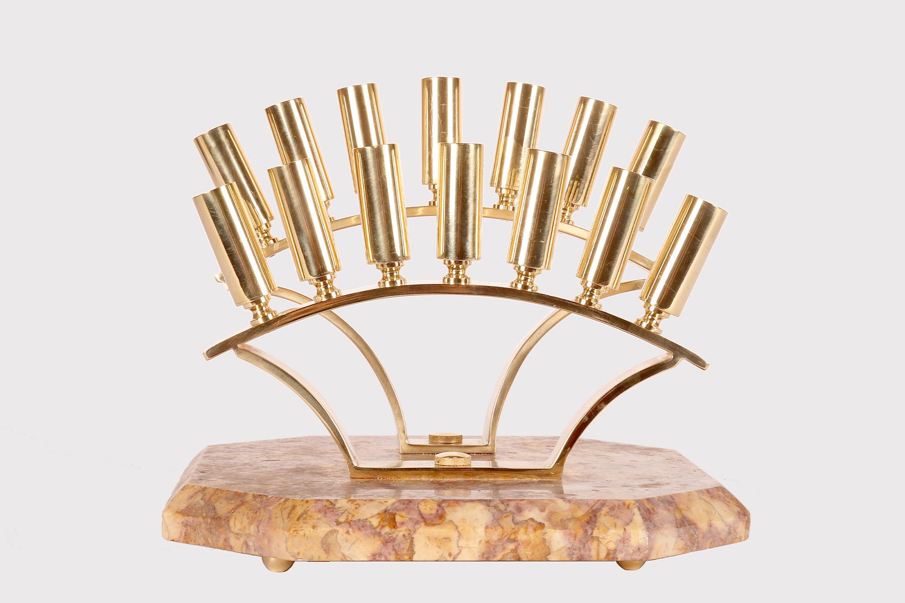 Stick holder display. The base, made of Breccia marble, octagonal in shape with edges finished with a beak of owl, rests on four spherical brass feet. Above the base, two brass fans are fixed from which 14 orifices made of small pieces of tube, also