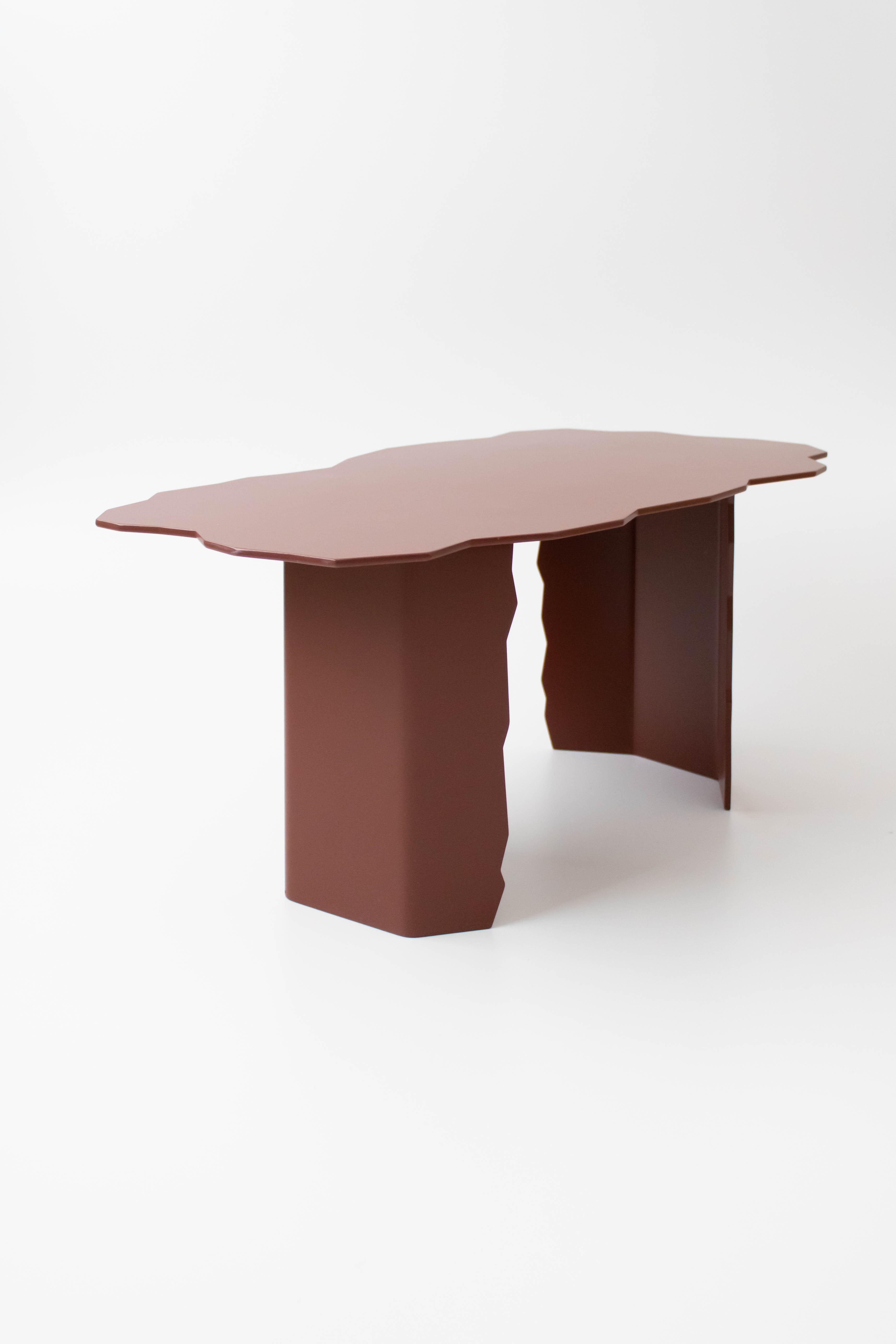 Disrupt low table by Arne Desmet
Dimensions: D42 x W75 x H34 cm
Materials: Powder coated aluminium.
Other colours available on request. 

The shapes of the Disrupt tables are inspired by the jagged edges formed by earth cracks. By means of