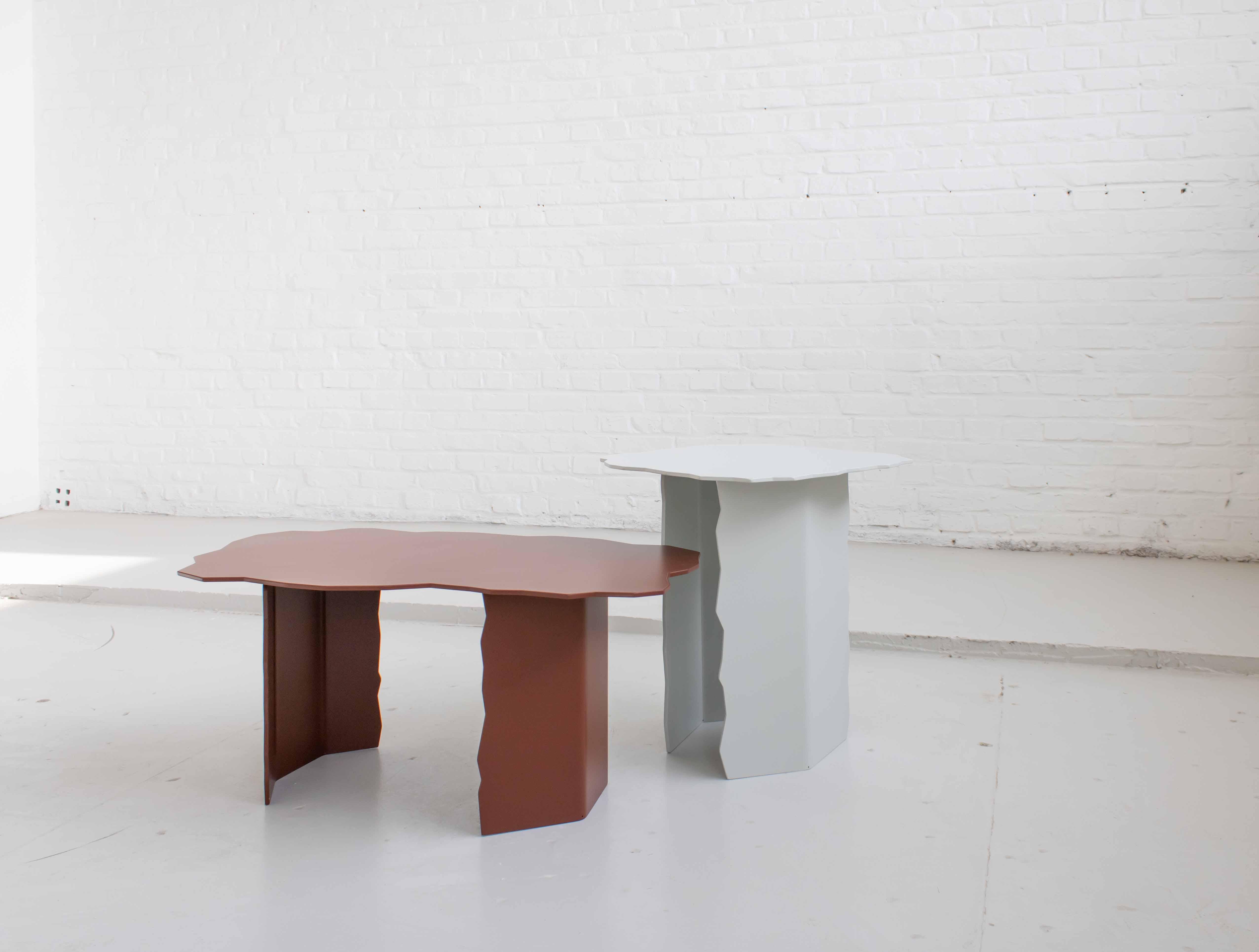 The jagged edges of the disrupt tables are inspired by the shape of earth cracks. The legs of the tables appear as if the were torn apart after ever forming one whole. An interesting play of light and shadow is created by the bended legs,