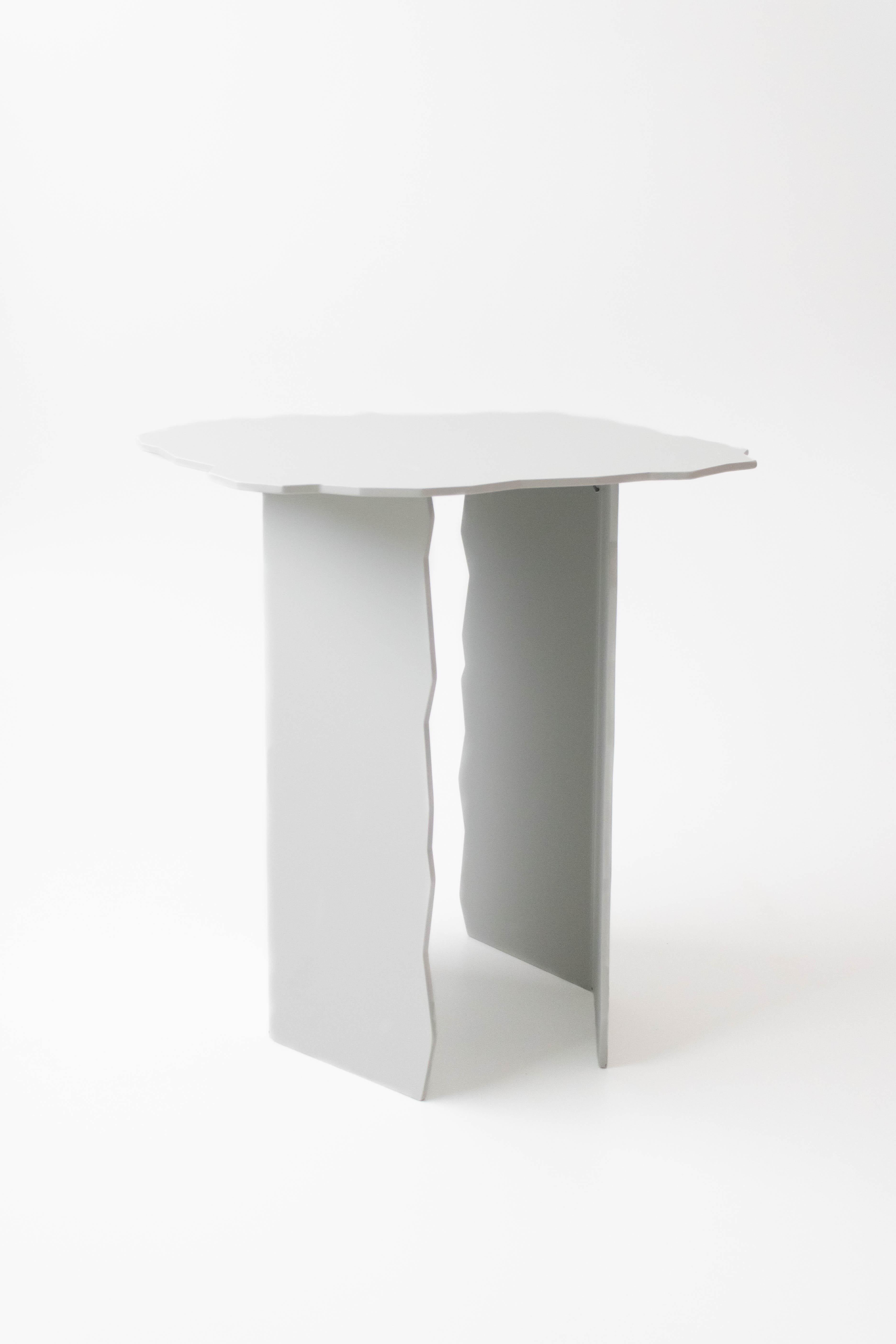 Disrupt Tall Table by Arne Desmet
Dimensions: D44 x W44 x H46 cm
Materials: Powder coated aluminium.
Other colours available on request.

The shapes of the Disrupt tables are inspired by the jagged edges formed by earth cracks. By means of