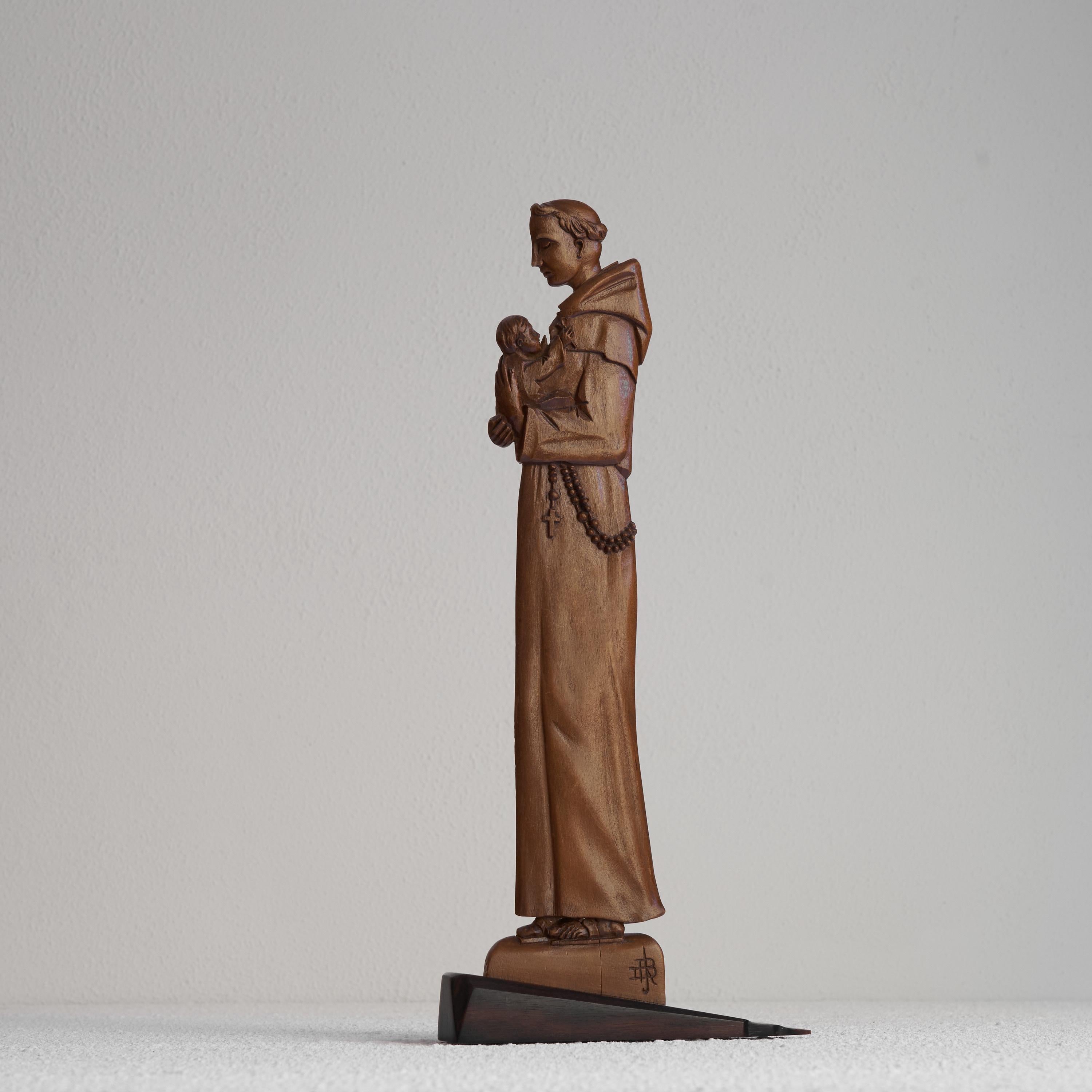 Distinct Hand Carved Art Deco Sculpture of a Religious Man with child. Early 20th century.

Distinct and skillfully hand-carved art deco wood sculpture of a religious man with child. Very art deco with sharp lines and the use of 'en-profile' in
