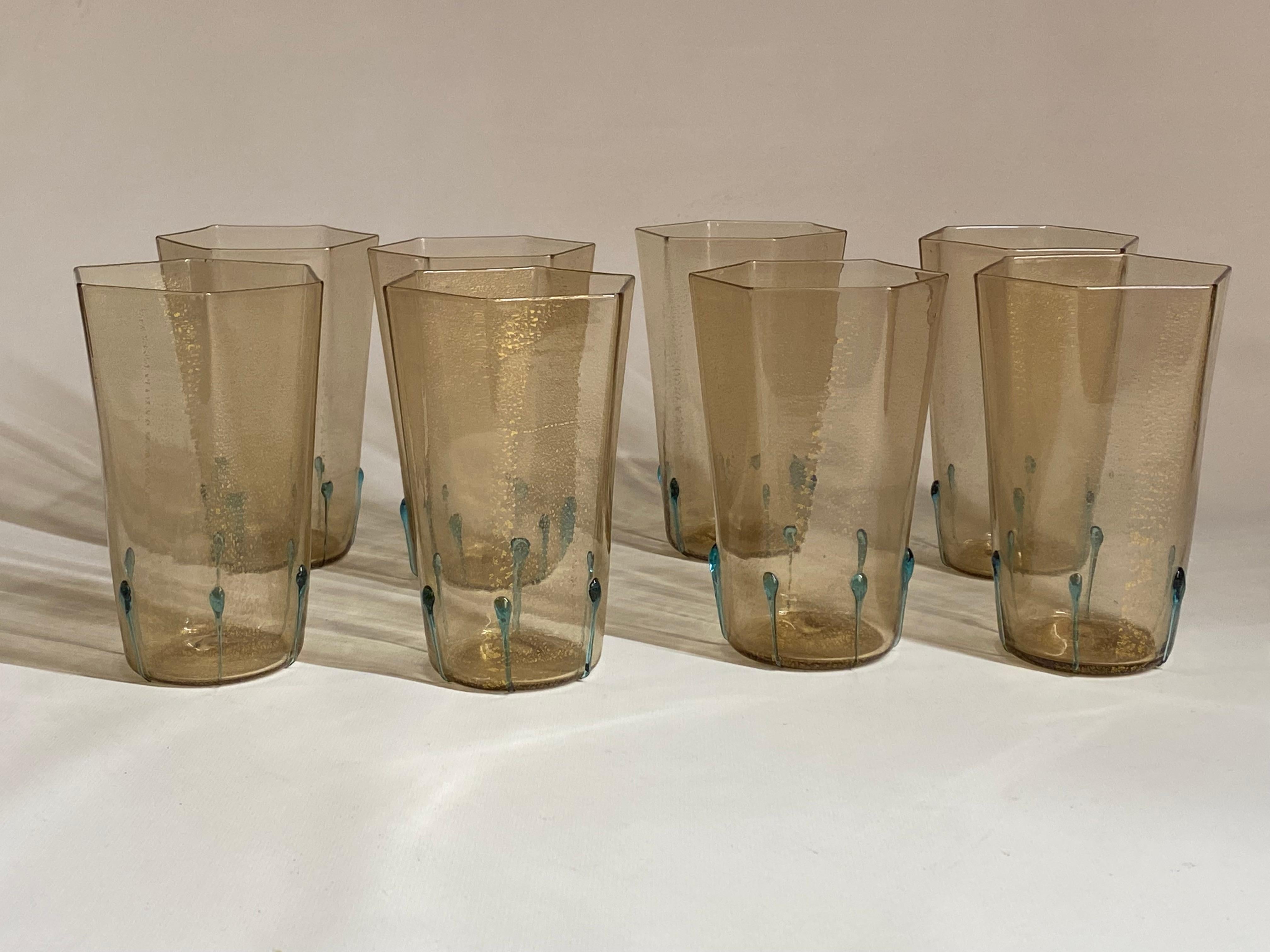 A fine set of eight hand blown hexagonal Murano drinking glasses with Aventurine inclusions. Lightweight, delicate and distinctly Italian. Hexagonal tops that taper off to a rounded base. Each glass is unique due to its technique in manufacturing.