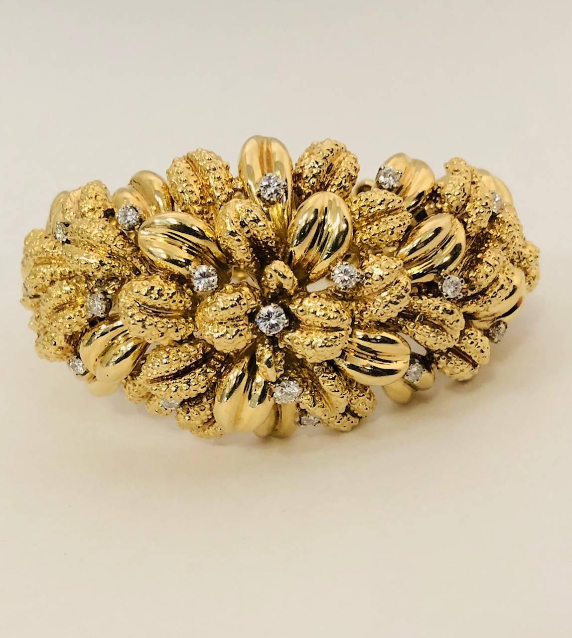 This stunning bracelet was purchased at a Christies Auction in 1960s for $18000 when gold sold at $36 an ounce! This meticulously crafted bracelet, in 18 karat yellow gold, is beyond notable! High polished and knobby finished 'leaves' are sprinkled