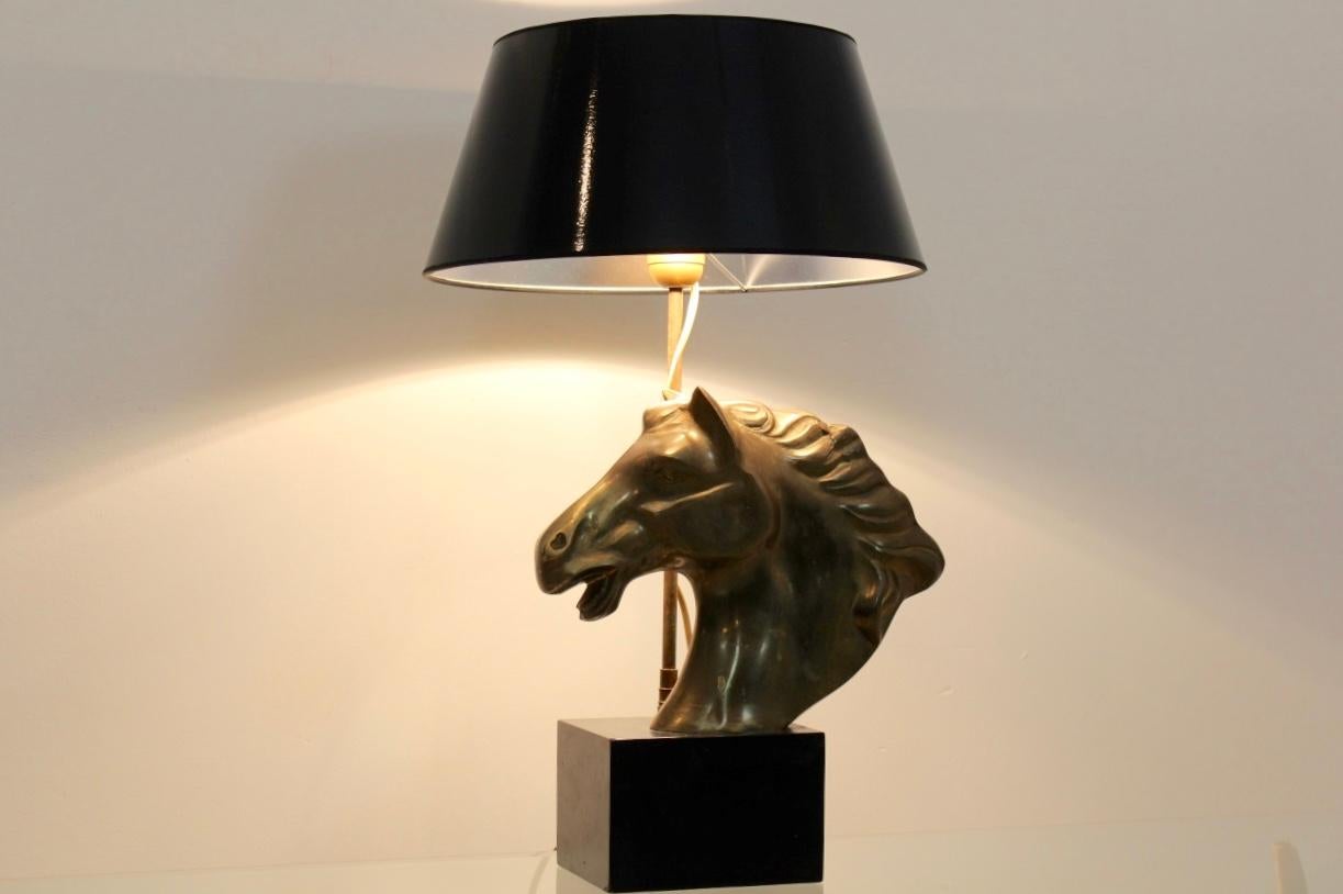 Unique and beautiful midcentury brass horsehead table lamp from the 1970s. The lamp is made in France and unique and has a sophisticated appearance. The beautiful black shade combined with the black marble base strengthens the horse’s distinctive
