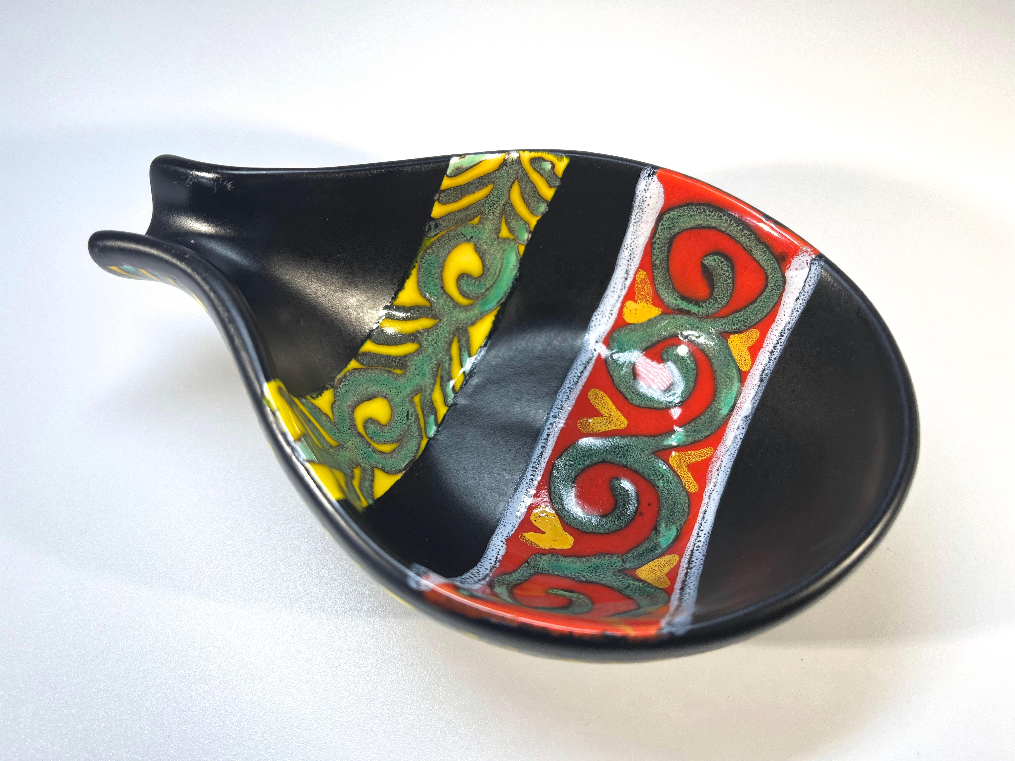 Superb petit ceramic vide poche by Gabriel Fourmaintraux 
Intense black glaze, hand decorated with  distinctive red, yellow and green enamel motifs
Circa 1950
Height 1.5 inch, Width 3.5 inch, Depth 5 inch
Excellent condition and glaze
Wear