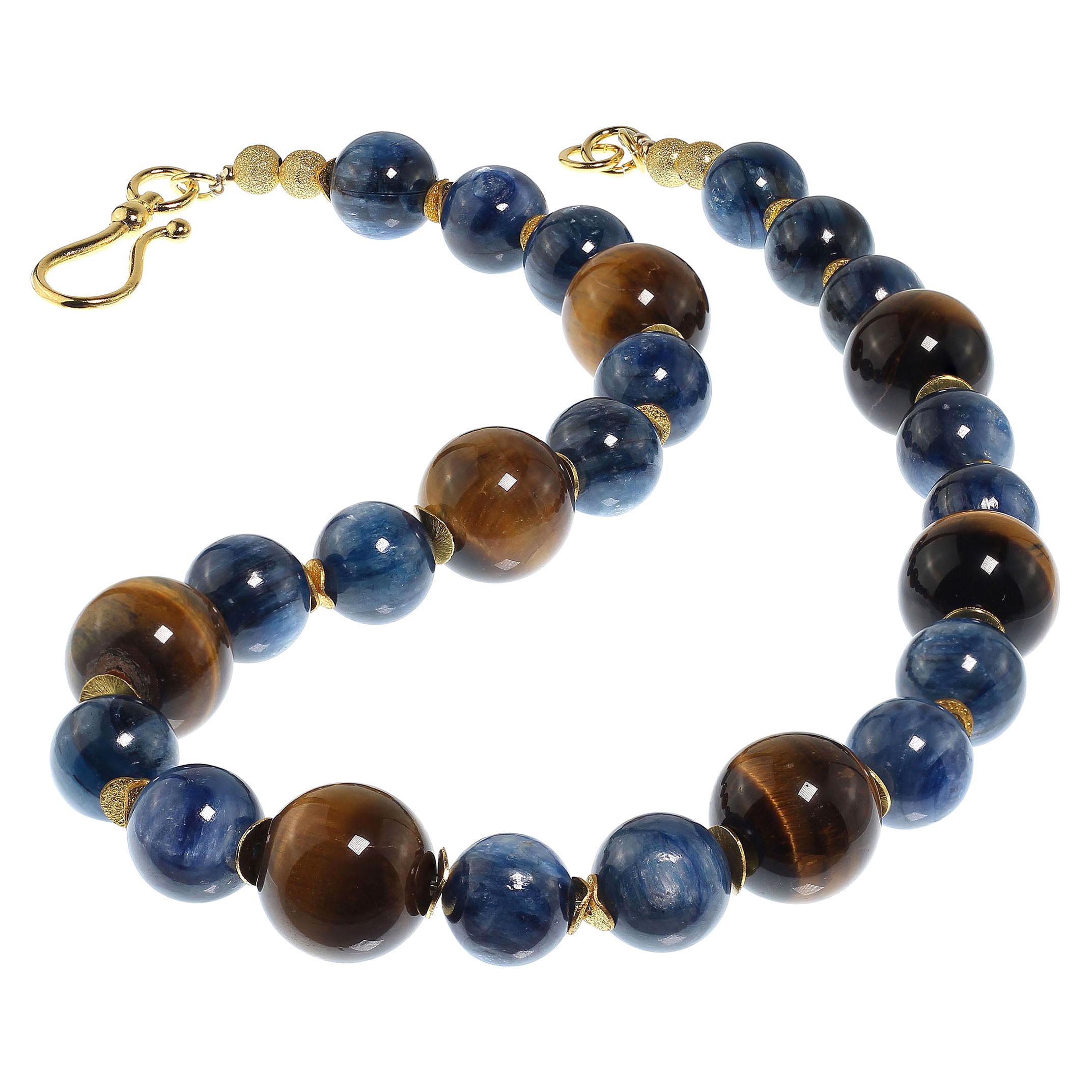 This distinctive  necklace combines two gemstones with chatoyancy and therefore play off each other to maximize their effect. Golden Brown Tiger's Eye is always a winner. Blue Kyanite is less well know however it's high polish and lovely chatoyancy