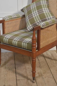 Distinguished mahogany bergère armchair