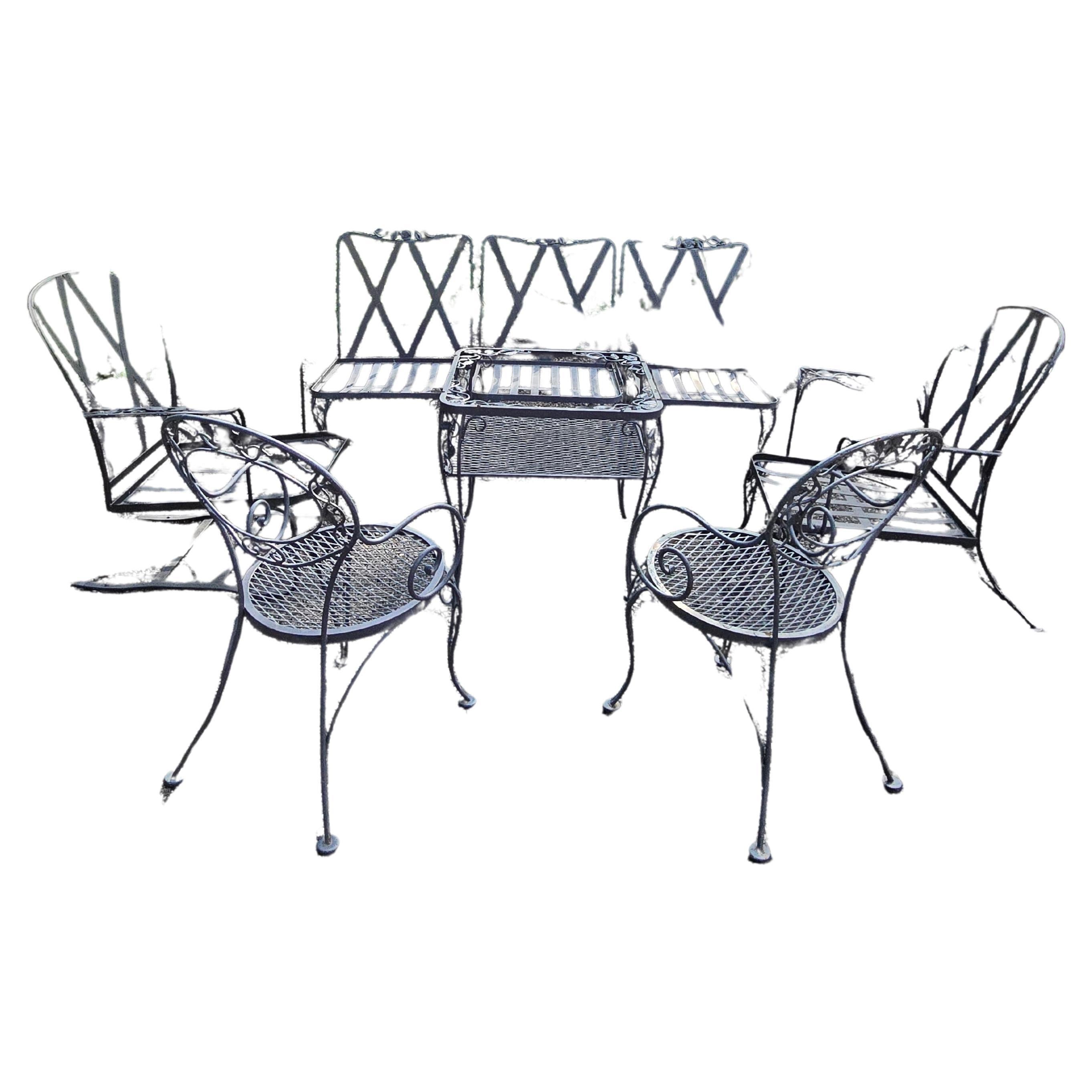 Add a touch of vintage charm to your outdoor space with this eight-piece wrought iron patio furniture set from Woodard. The set includes a table, 3 piece deep seared sofa, 2 lounge chairs, and 2 bistro chairs, all made from durable wrought iron, and