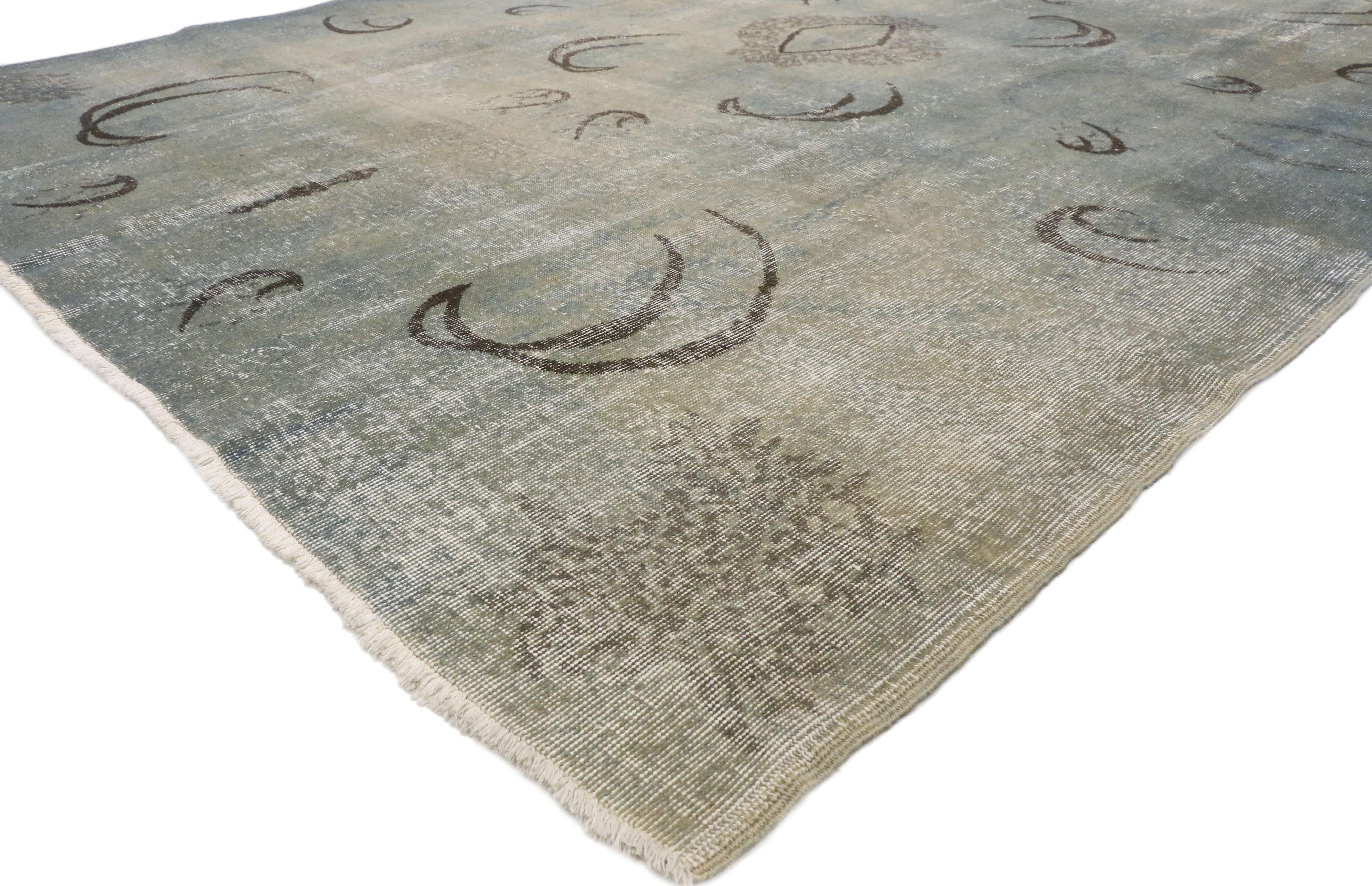 50856 Distressed Vintage Turkish Sivas Rug 07'05 X 10'02.
With its simplicity and Zeki Muren style, this hand-knotted wool distressed vintage Turkish Sivas rug provides a feeling of cozy contentment without the clutter. The weathered field features