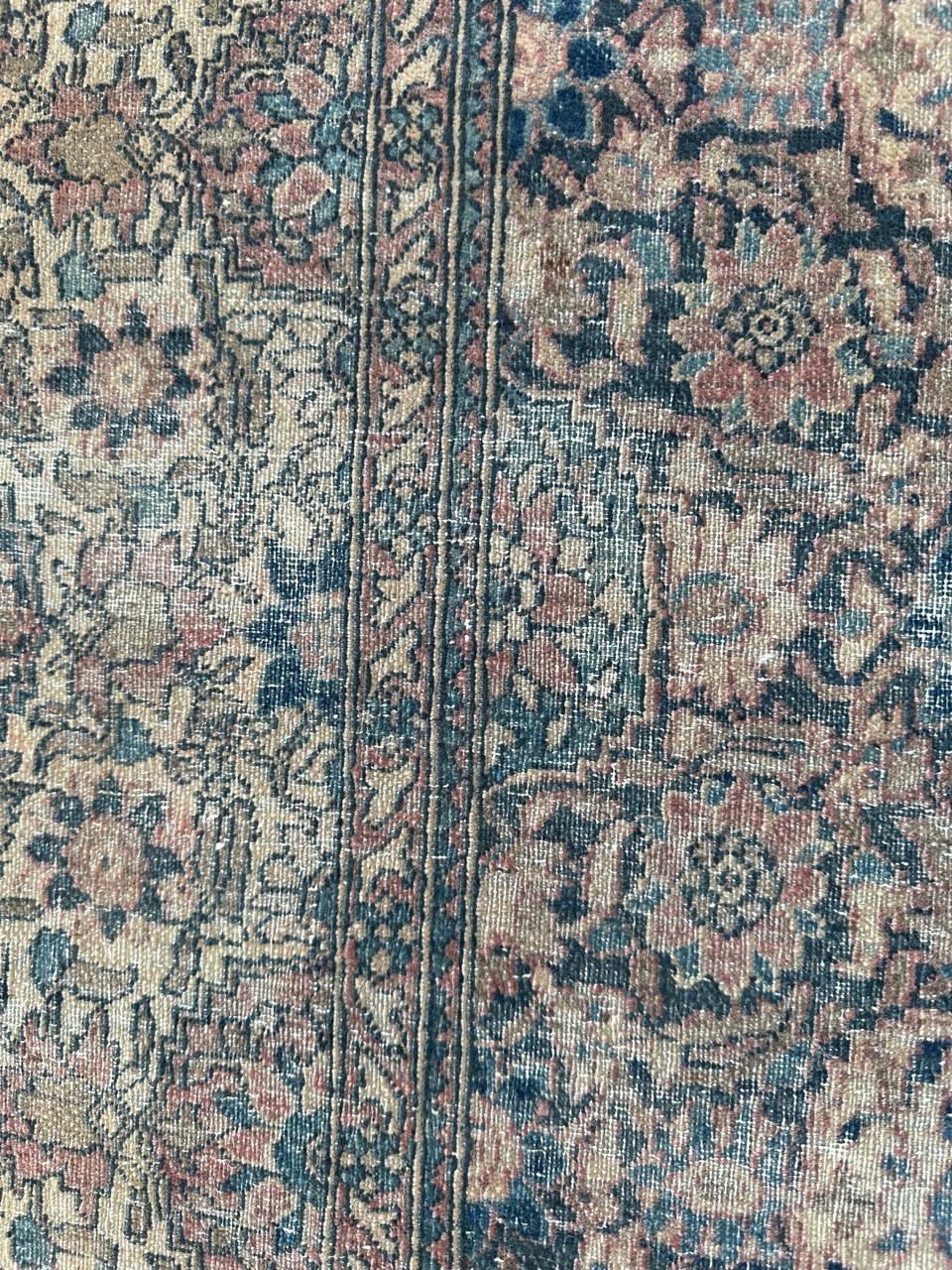 Wool Distressed antique 19th century Isfahan rug For Sale