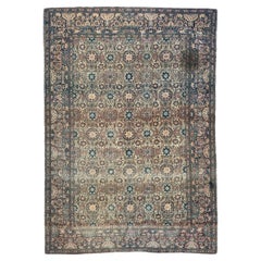 Distressed antique 19th century Isfahan rug