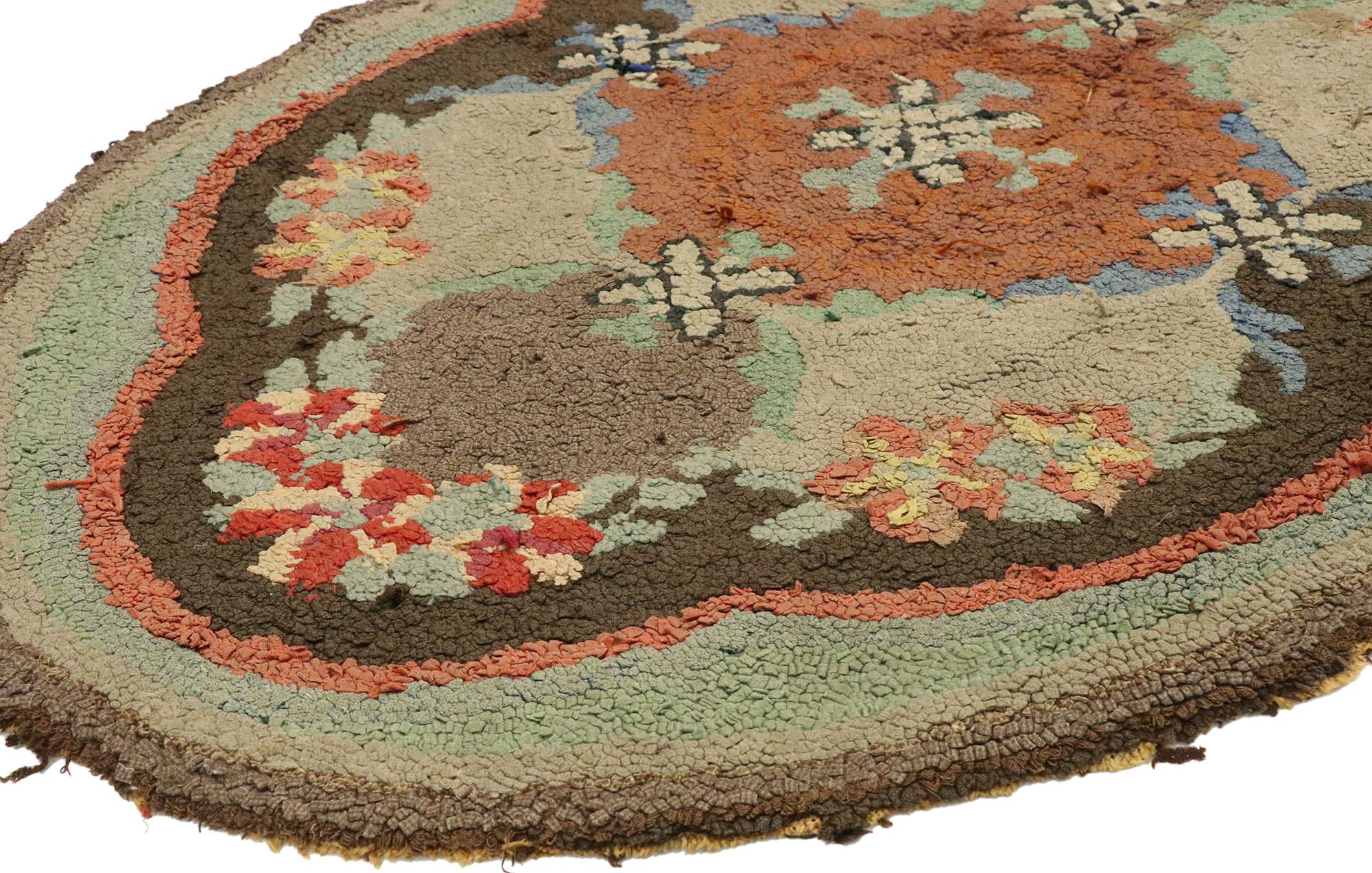 74355, distressed antique American hooked oval rug with American Colonial style. Showcasing timeless elegance and rugged beauty, this lovingly time-worn antique American hooked oval rug beautifully embodies American Colonial style. It features a
