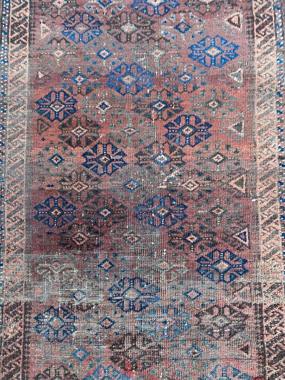 Beautiful tribal Baluch rug with geometrical design and nice natural colors, entirely hand knotted with wool velvet on wool foundation.