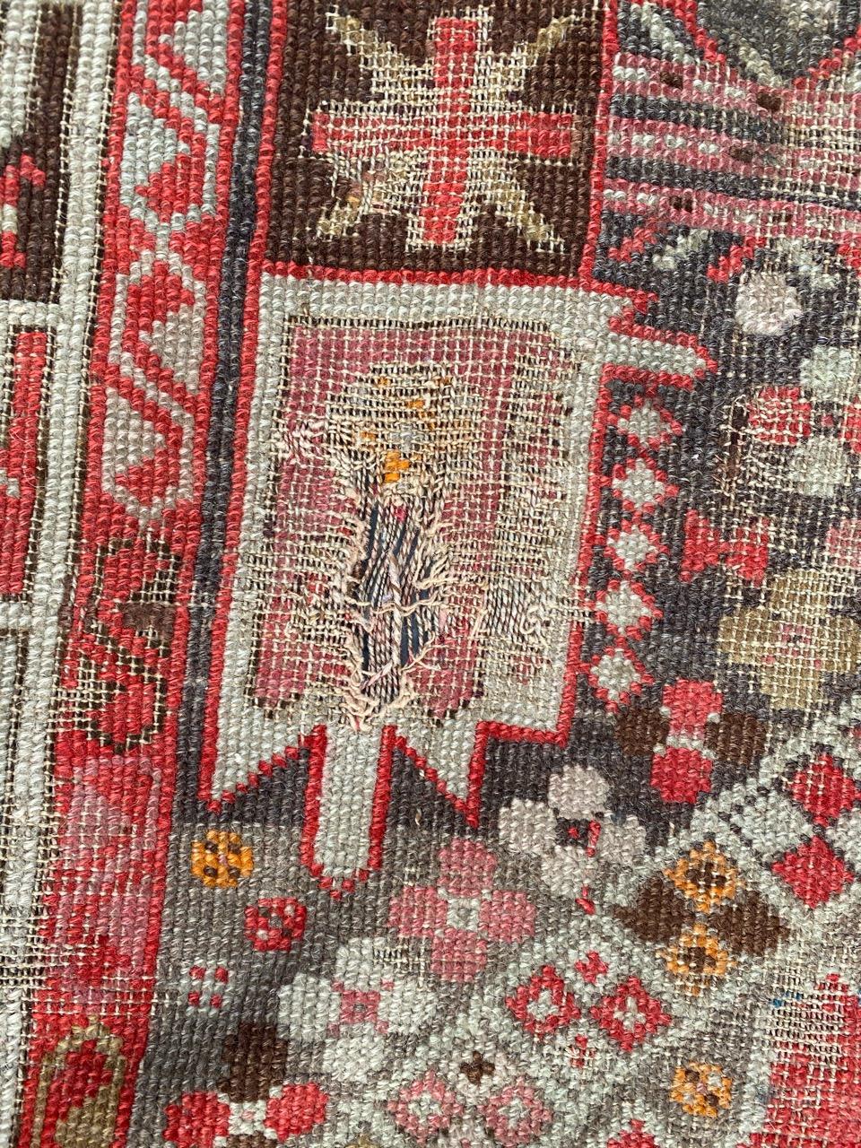 Distressed Antique Caucasian Karabagh Rug In Distressed Condition In Saint Ouen, FR