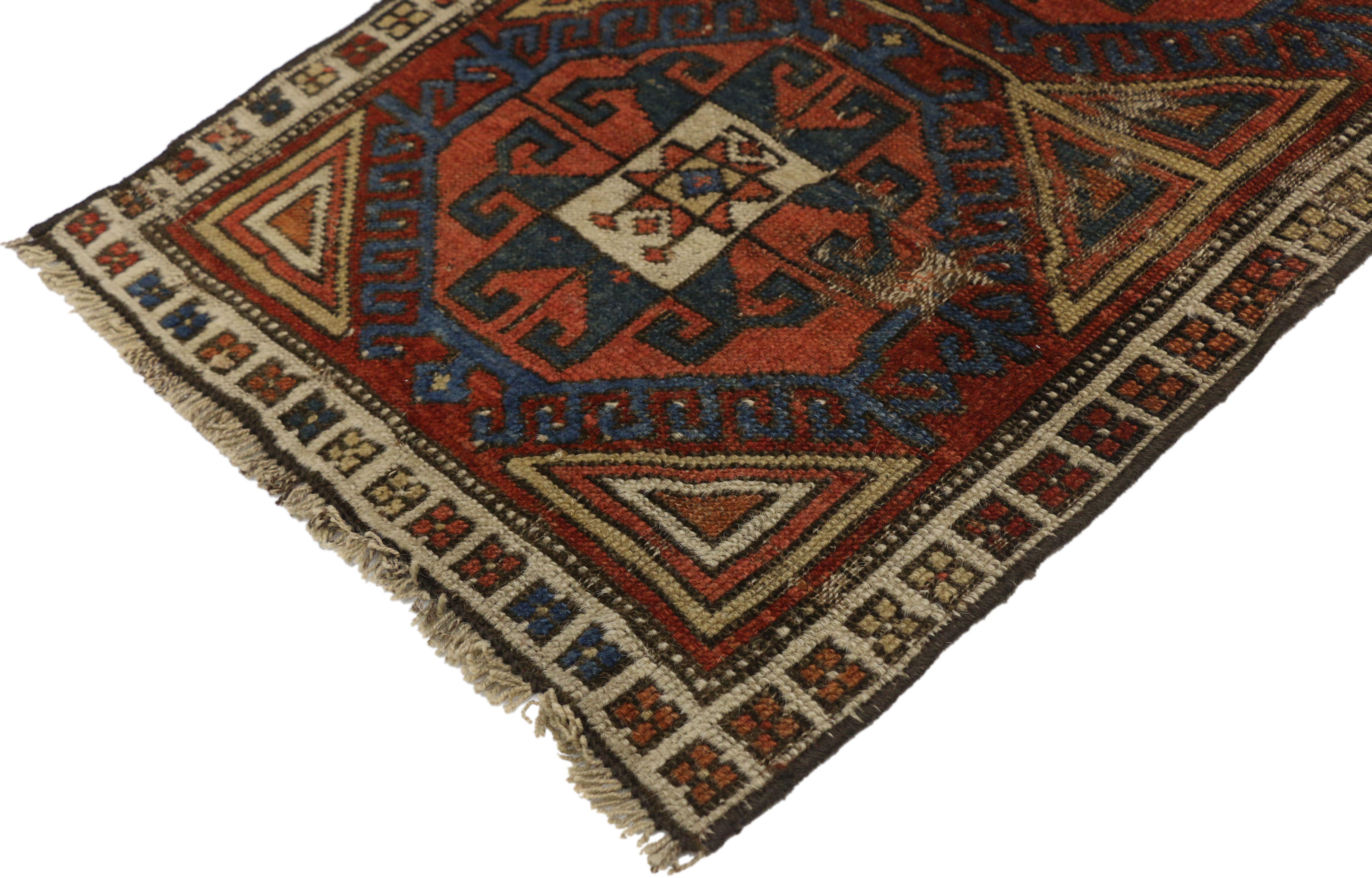 77270 Distressed Antique Caucasian Kazak Scatter Rug with Rustic Tribal Style 01'07 x 02'03. This hand knotted wool distressed antique Caucasian Kazak scatter rug features two large red octagonal guls outlined with royal blue latch-hooks edges. Each