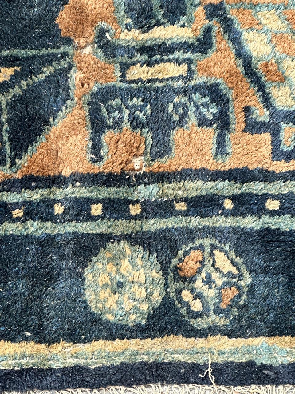 Distressed antique Chinese rug For Sale 9