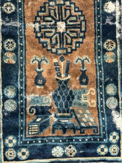Distressed antique Chinese rug