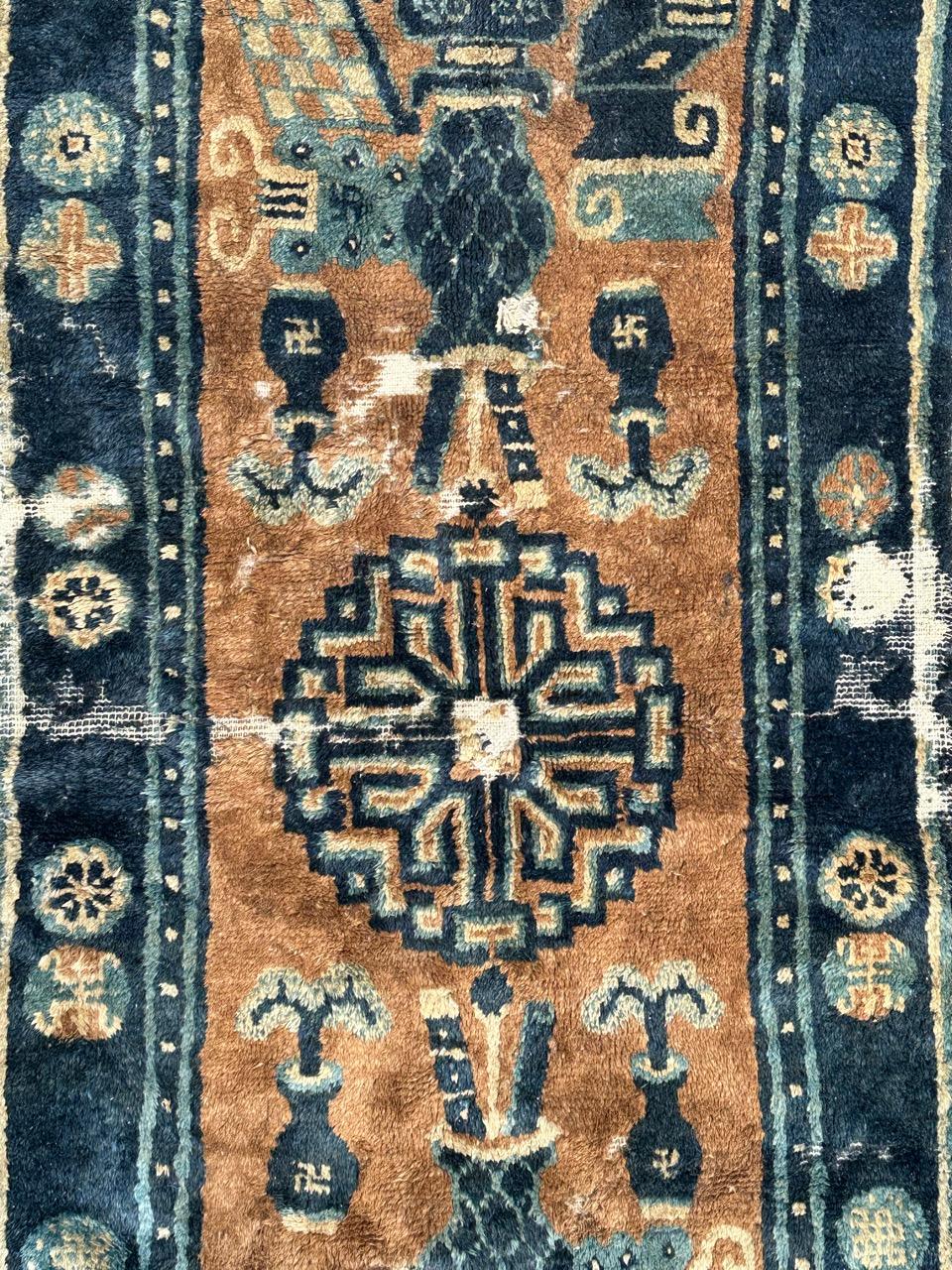 Chinoiserie Distressed antique Chinese rug For Sale