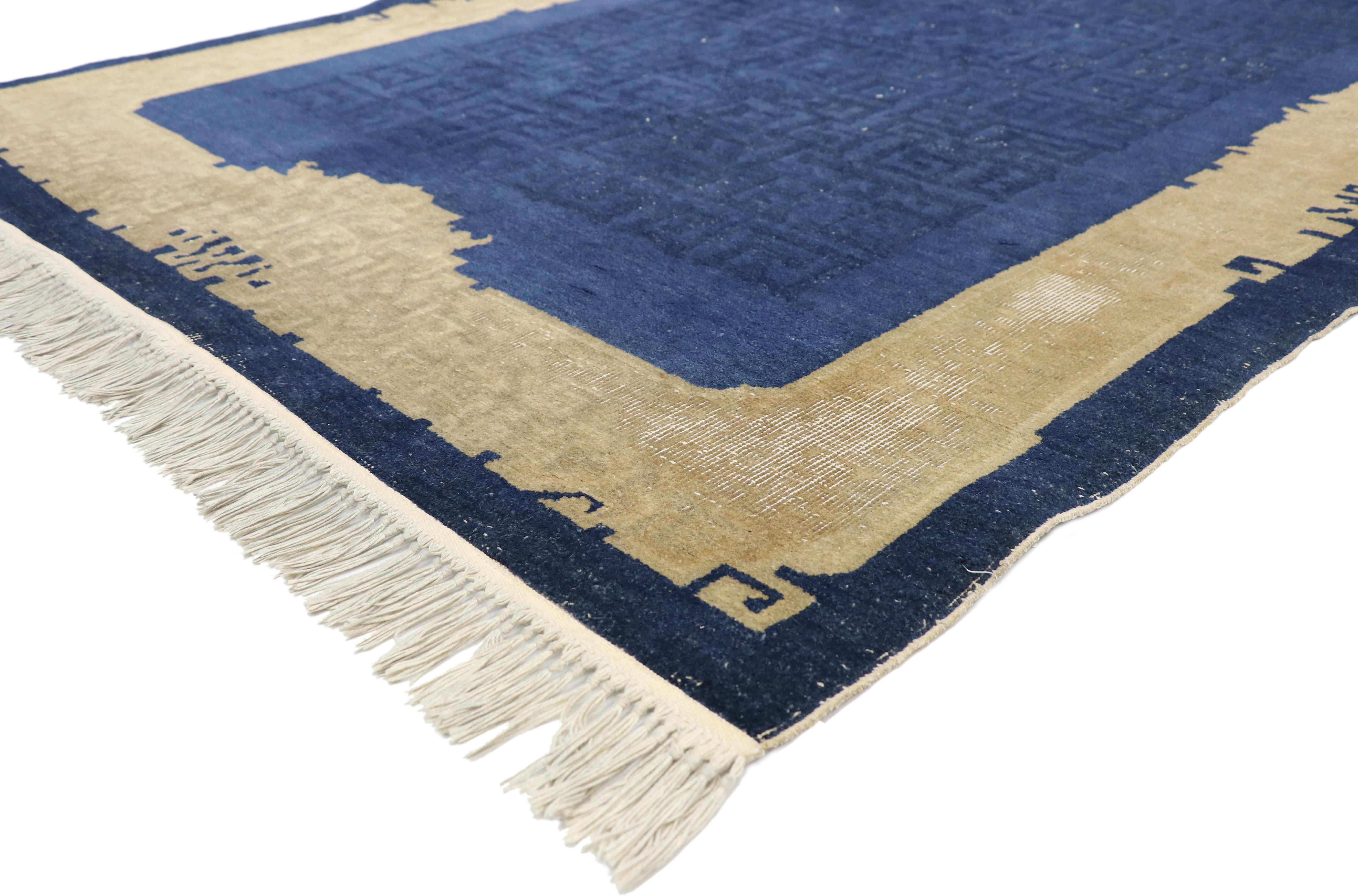 77364, distressed antique Chinese rug with Traditional chinoiserie style. This hand knotted wool distressed antique Chinese rug features a subtle all-over fretwork pattern spread across an abrashed blue field. In written Chinese, the Wan character