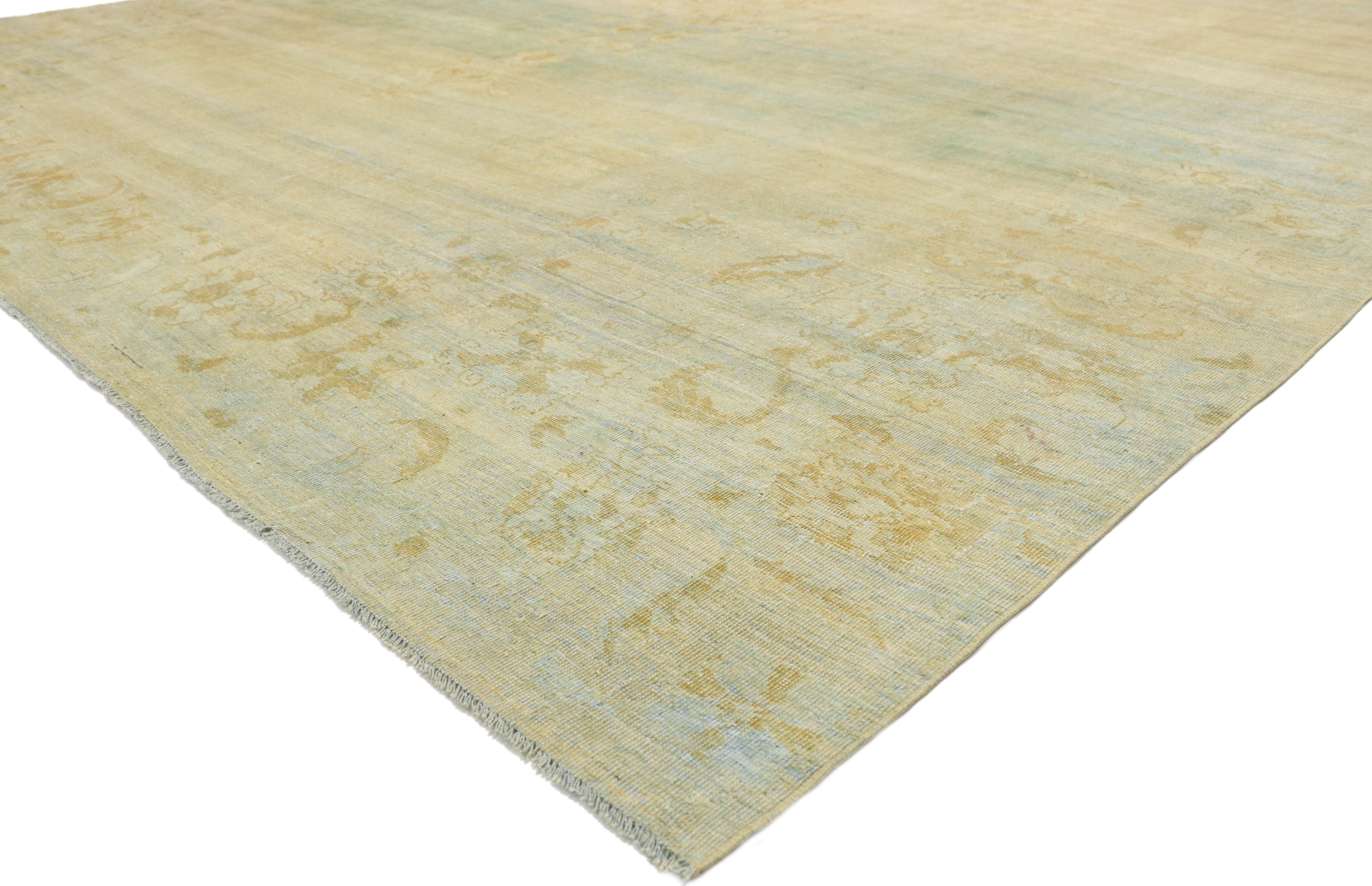 72621, distressed antique Indian Agra Palace rug with Tropical British Colonial style 11'08 X 16'04. With its casual elegance and lovingly timeworn appearance combined with light and airy colors, this hand knotted wool distressed antique Indian
