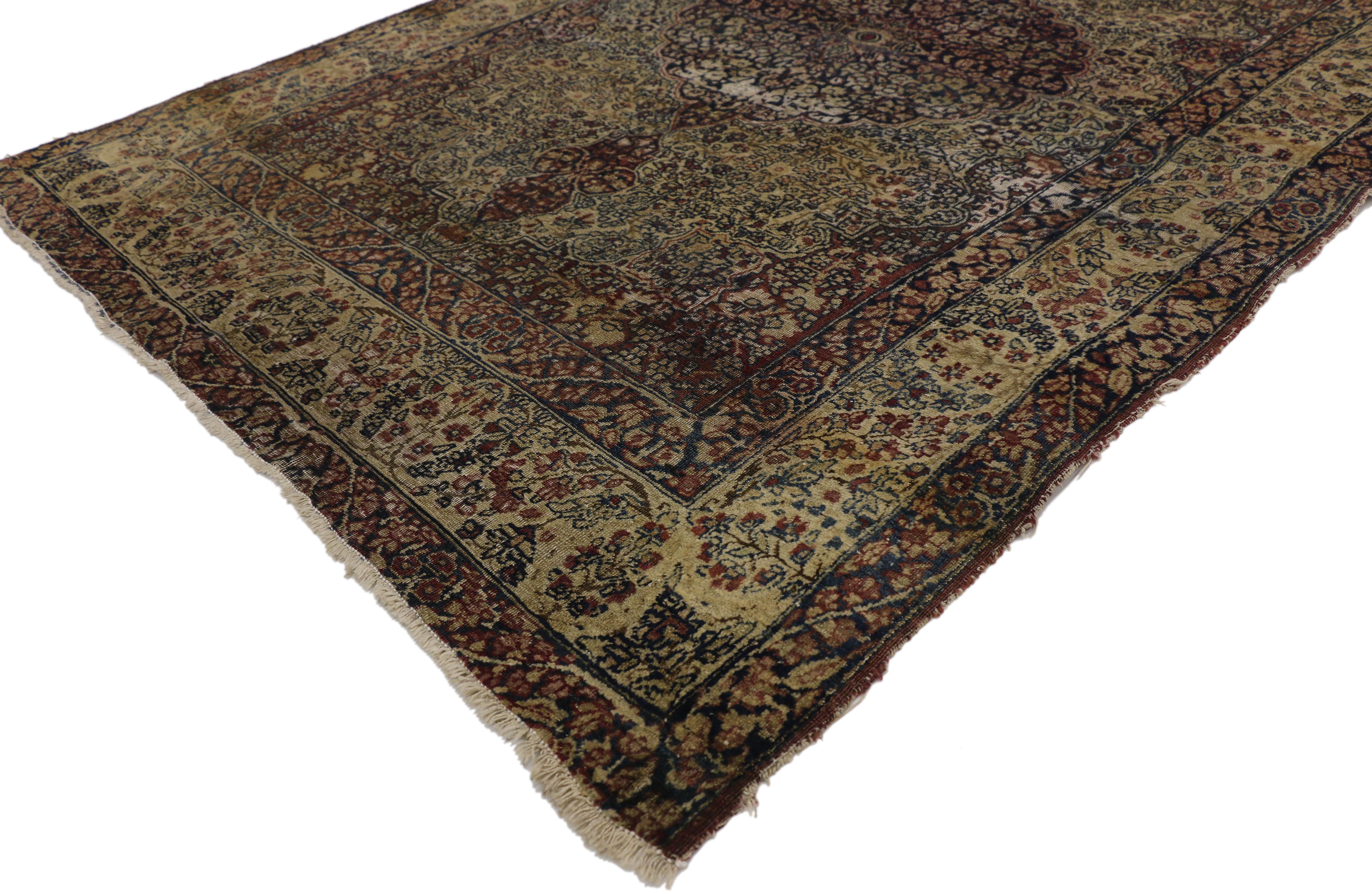 73167 Late 19th Century Distressed Antique Kermanshah Persian Rug with Rustic English Style 04'02 x 06'00. Balancing a timeless floral design with traditional sensibility and a lovingly timeworn patina, this hand knotted wool distressed antique