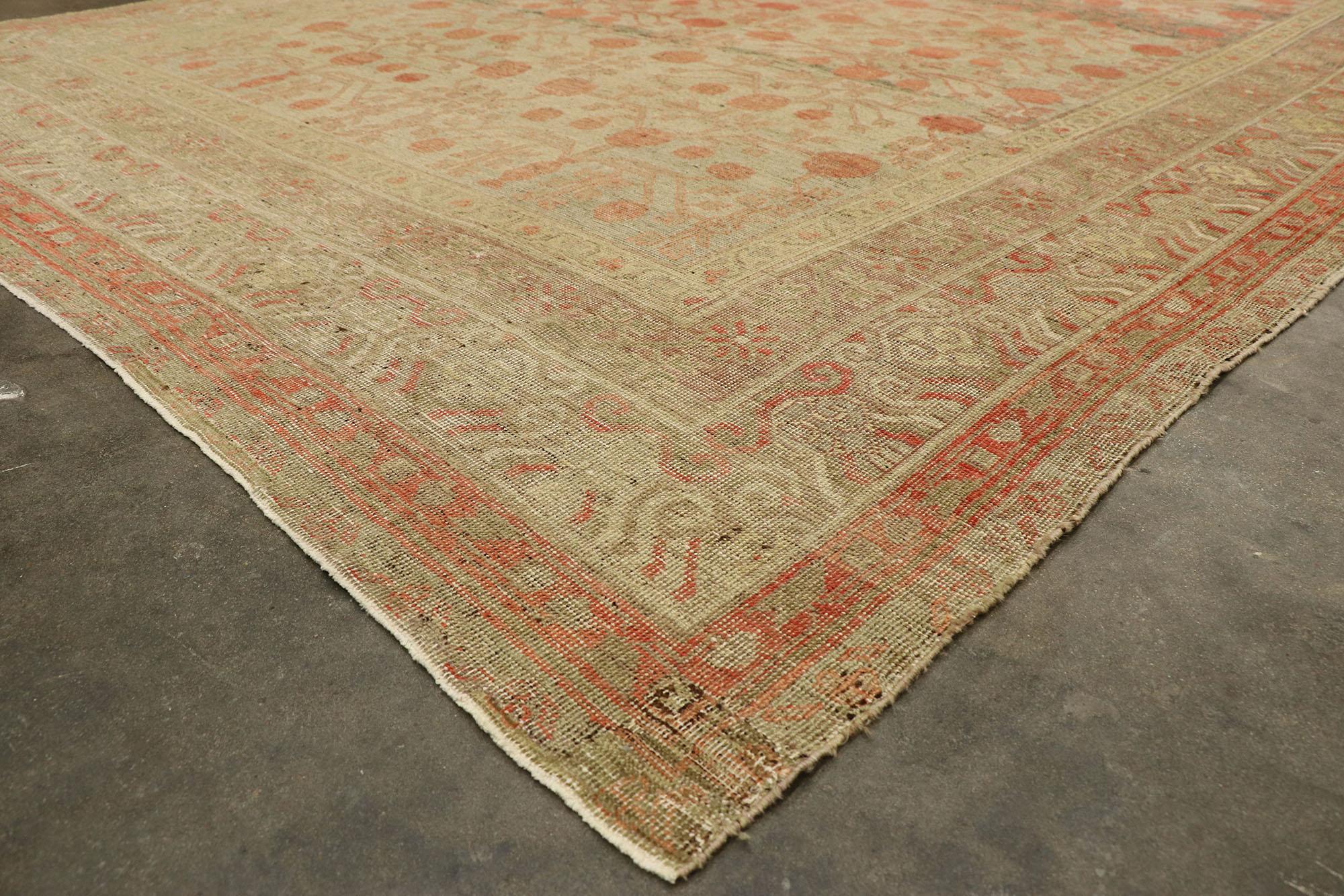 20th Century Distressed Antique Khotan Gallery Rug with Pomegranate Design For Sale