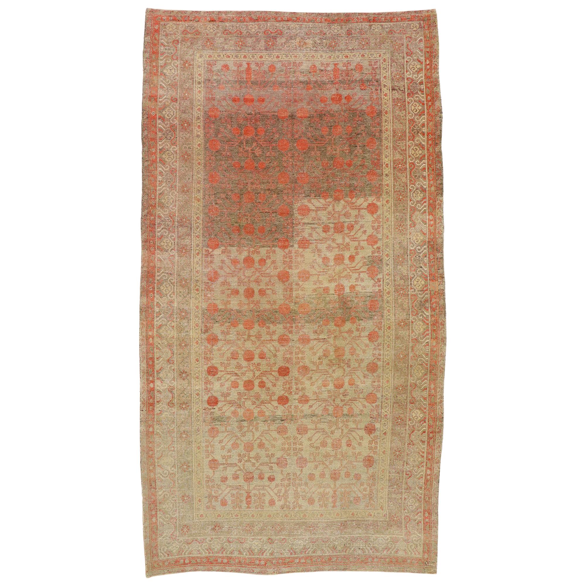 Distressed Antique Khotan Gallery Rug with Pomegranate Design For Sale