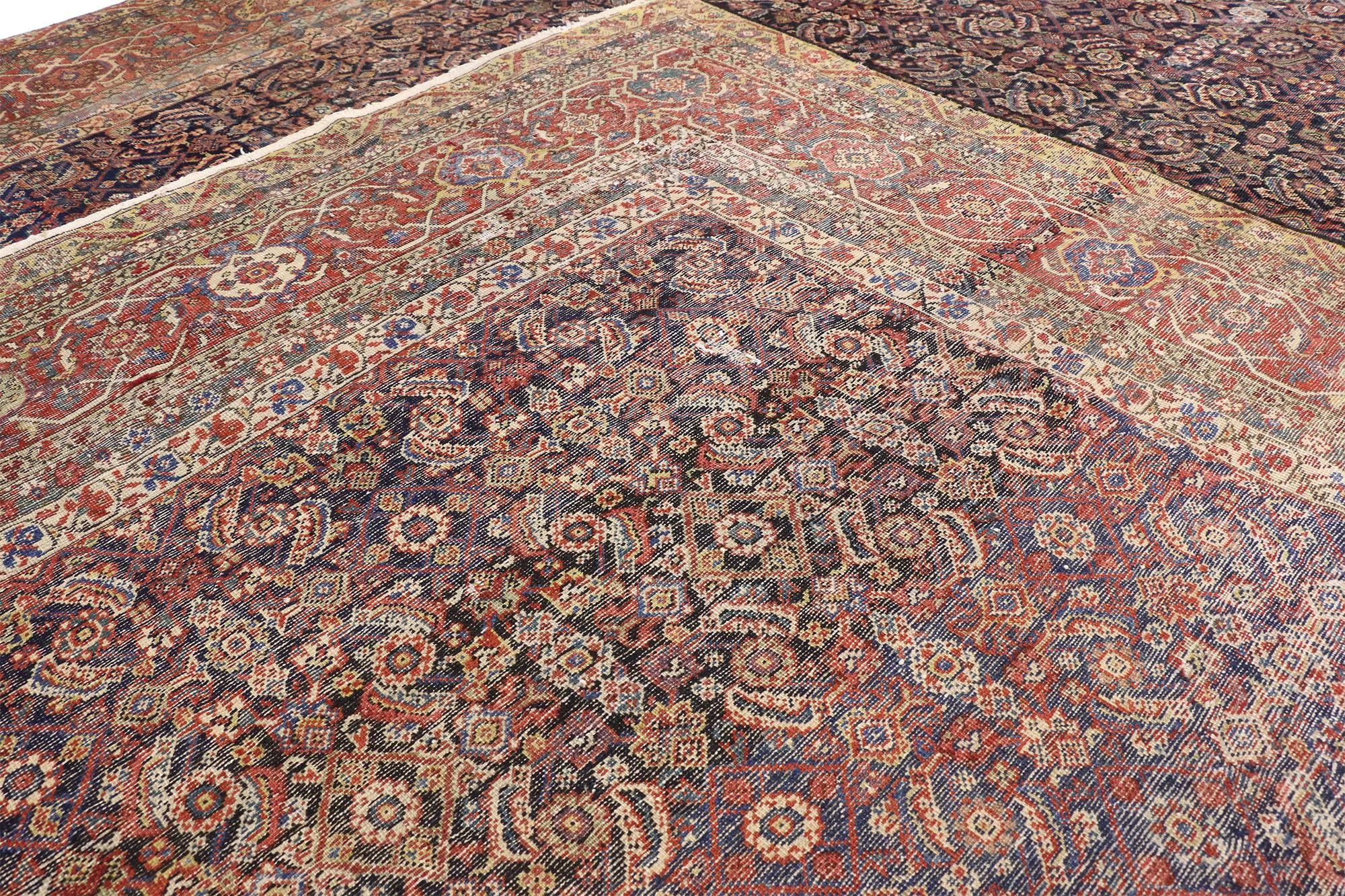 Persian Distressed Antique Farahan Rug, Weathered Finesse Meets Rustic Sensibility For Sale