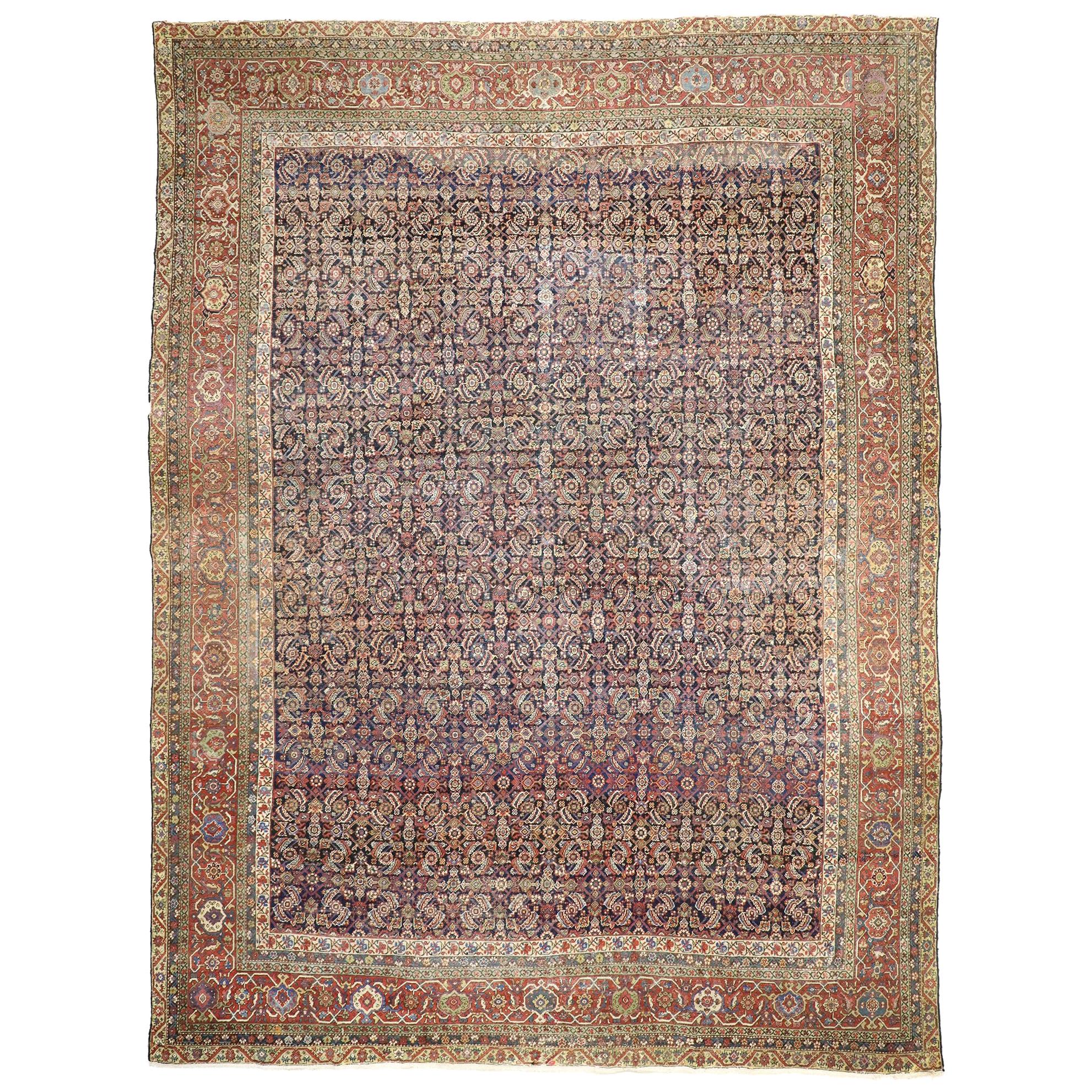 Distressed Antique Farahan Rug, Weathered Finesse Meets Rustic Sensibility For Sale