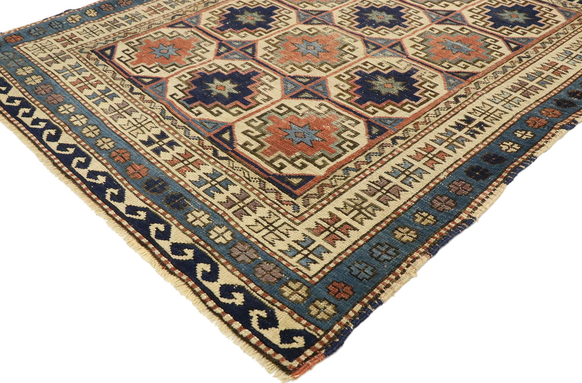 53039, distressed antique Moghan Memling Gul Kazak rug with Modern Tribal style. Displaying inimitable warmth and native charm with rustic sensibility, this hand knotted wool distressed antique Kazak square rug beautifully embodies a modern tribal