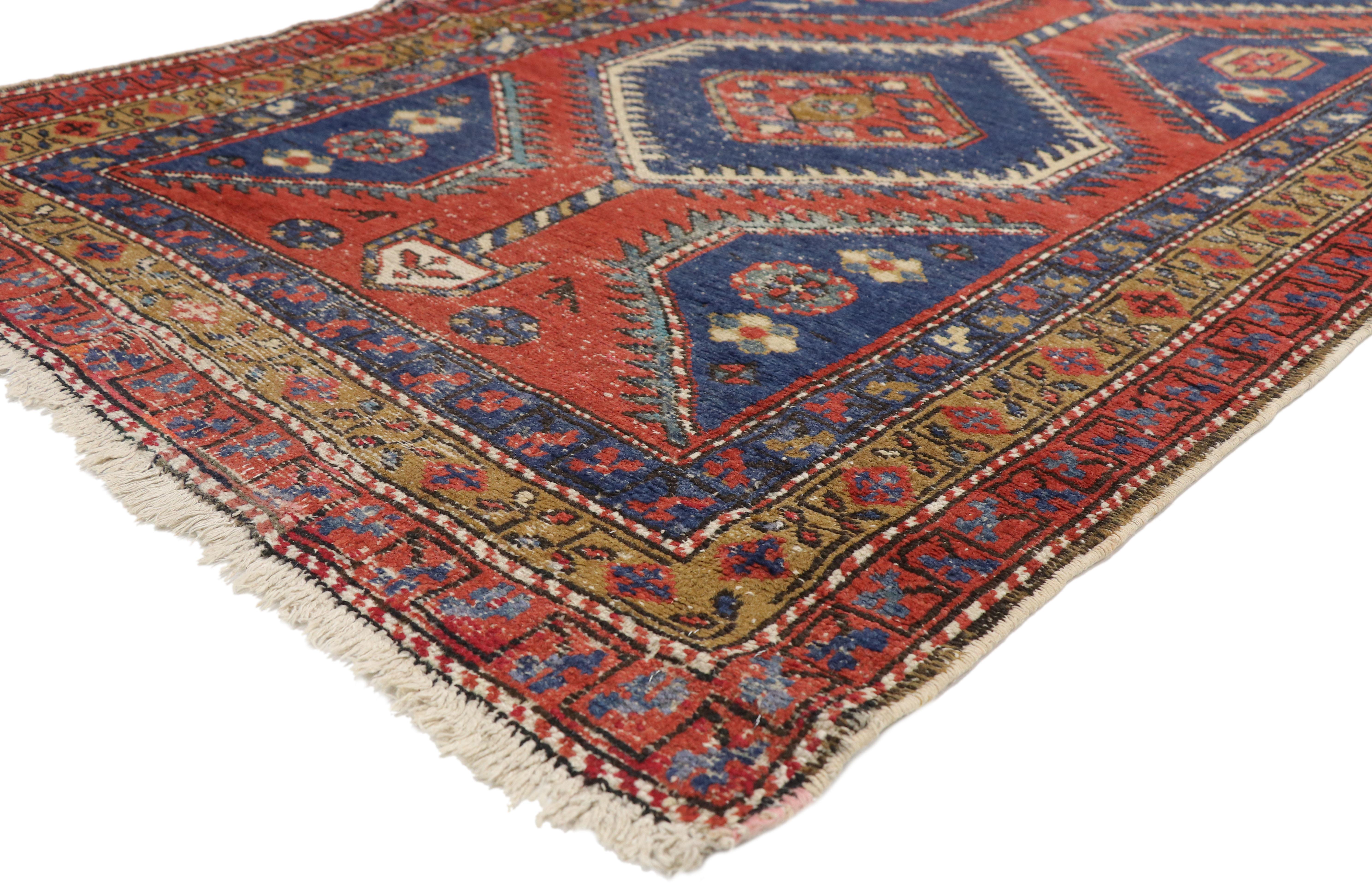 75644, distressed antique Persian Azerbaijan runner with industrial Tribal style. Displaying tribal charm and nomadic tribal style, this hand knotted wool distressed antique Persian Azerbaijan runner is an amalgam of Caucasian tribal influence. The