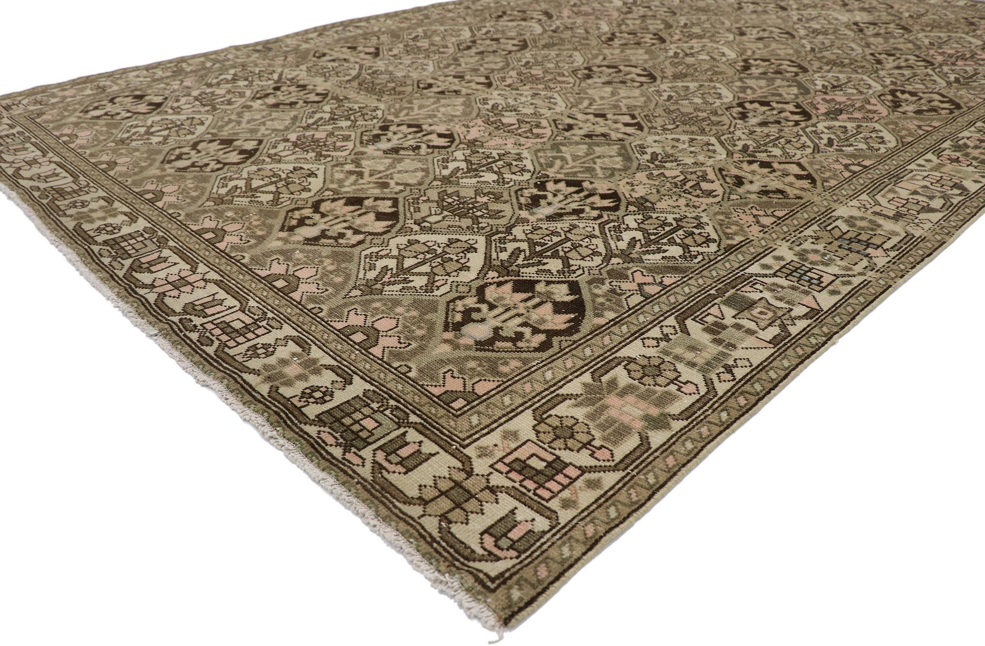 60942, distressed antique Persian Bakhtiari rug. With its rustic sensibility and timeless botanical pattern, this hand-knotted wool distressed antique Persian Bakhtiari rug will take on a curated lived-in look that feels timeless while imparting a