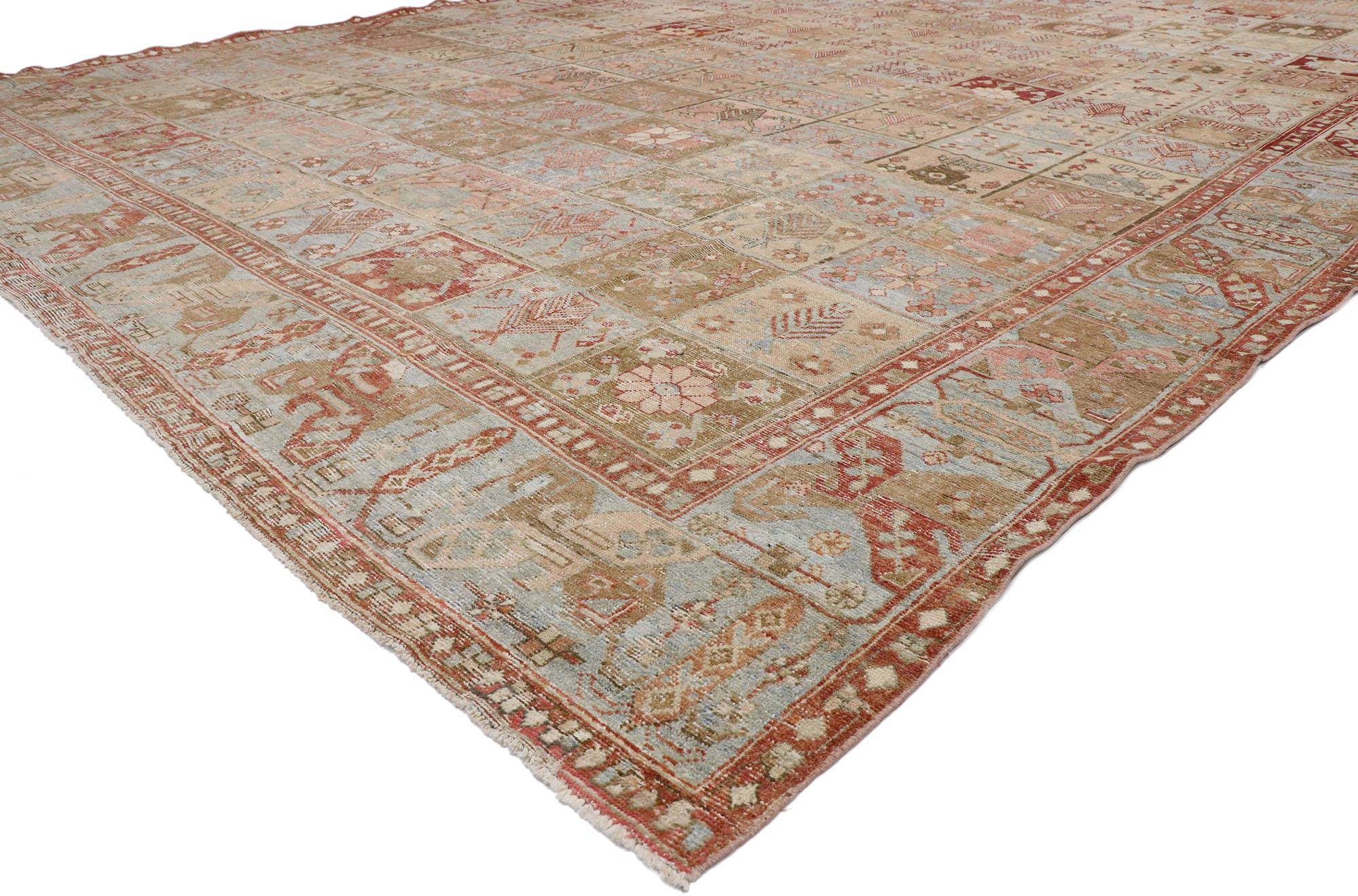 53388, distressed antique Persian Bakhtiari rug with modern French Rustic style. With its perfectly worn-in charm and rustic sensibility, this hand knotted wool distressed antique Persian Bakhtiari rug takes on a curated lived-in look that feels