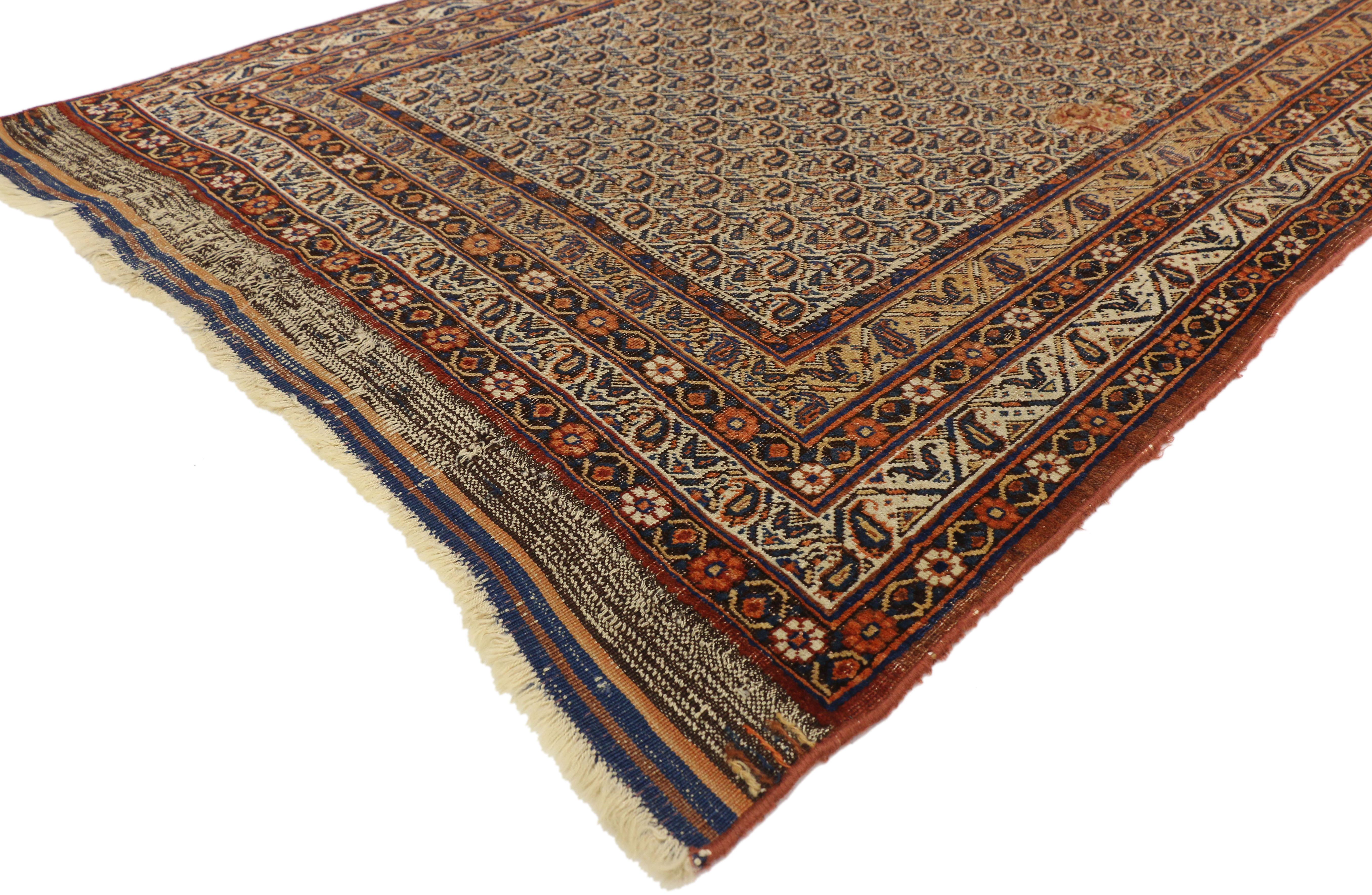 74395 Distressed Antique Persian Bijar Accent Rug with Rustic Craftsman Style 04'04 x 06'04. This hand knotted wool distressed antique Persian Bijar Accent rug feature an all-over the boteh pattern spread across the field, enhancing the depth that
