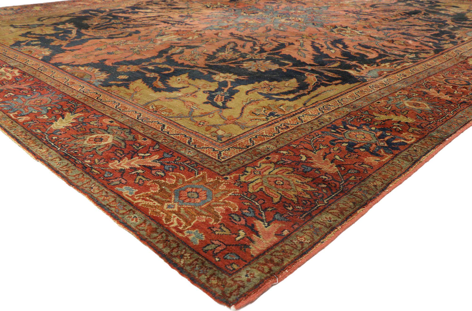 76816, distressed antique Persian Farahan rug with modern rustic English style. Displaying rustic sensibility and a relaxed English style with a lovingly time-worn composition, this hand knotted wool distressed antique Persian Farahan rug is