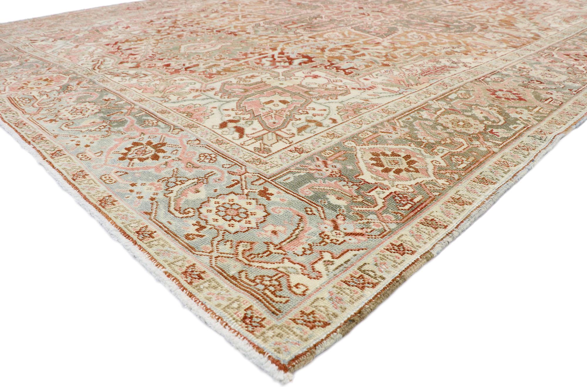 52667, distressed antique Persian Heriz Design rug with Rustic Arts & Crafts style. This hand knotted wool distressed antique Persian Heriz design rug features a large octofoil center medallion with flaming palmette pendants floating on an abrashed