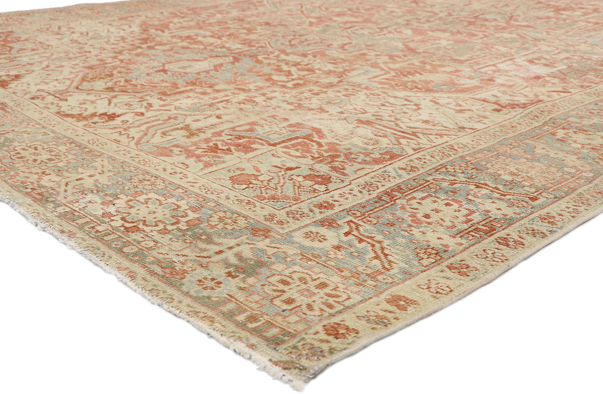 52668, distressed antique Persian Heriz Design rug with Rustic Bungalow style. This hand knotted wool distressed antique Persian Heriz design rug features a large octofoil medallion with flaming palmette pendants floating in the center of an