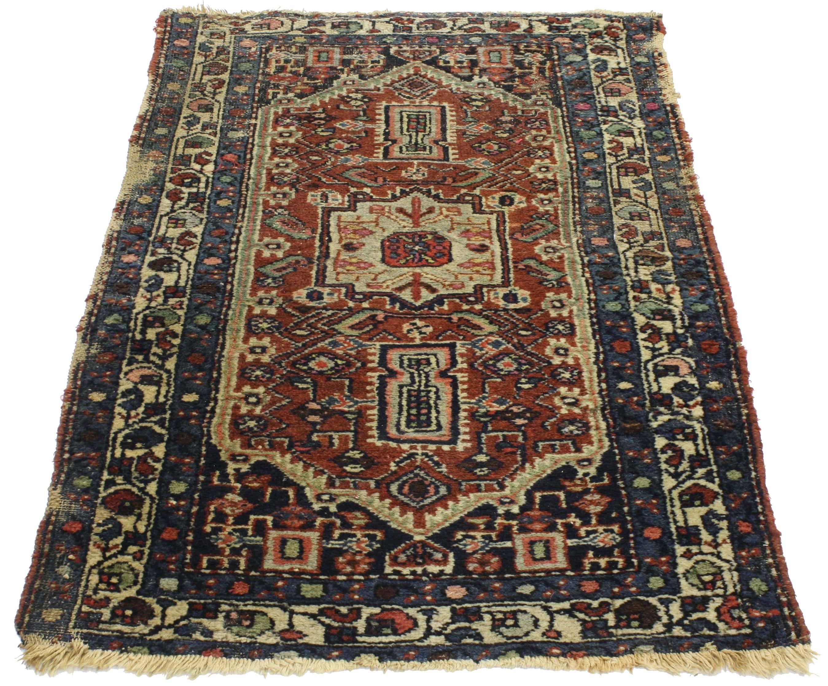 76667 Distressed Antique Persian Heriz rug, study or home office worn rug. Time-worn and richly ornamented, this distressed antique Persian Heriz rug offers warm and cool tones in a traditional medallion design. With its perfectly worn-in charm, pop