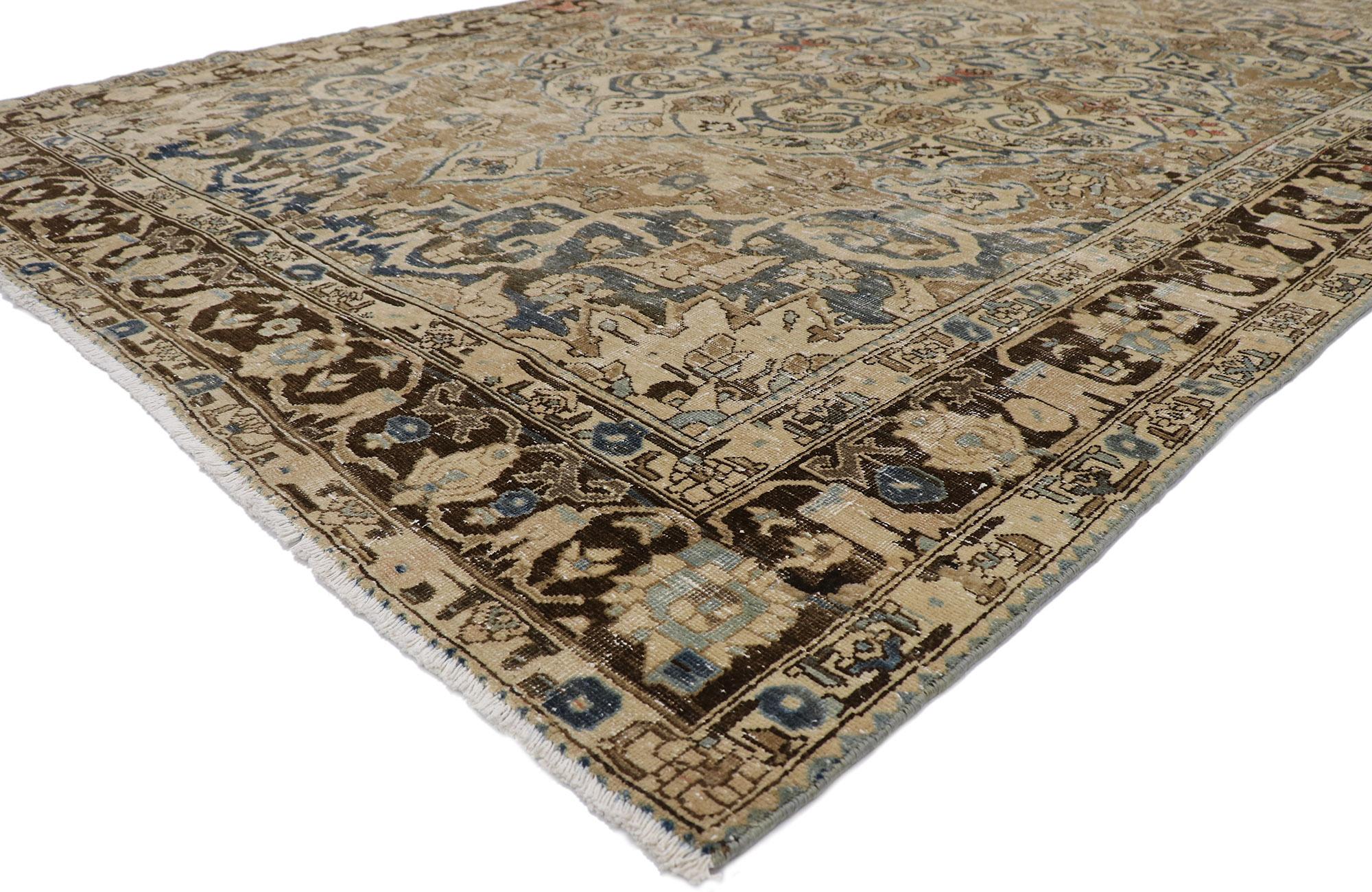 60935 distressed antique Persian Heriz rug with Mid-Century Modern style 08'03 x 11'11. Warm and inviting with Mid-Century Modern style, this hand-knotted wool distressed antique Persian Heriz rug features a large round center medallion anchored