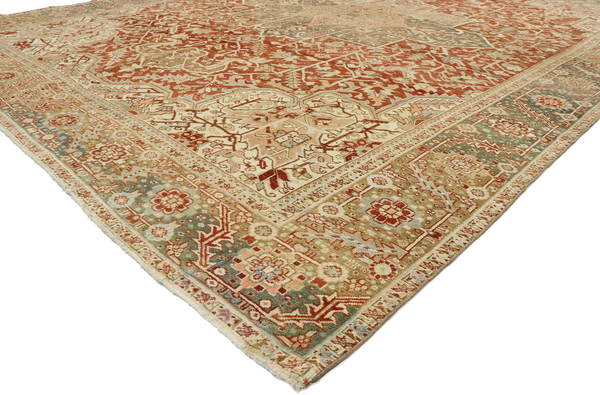 53172 Distressed Antique Persian Heriz Rug, 11'02 x 14'02. ​Persian Heriz rugs are esteemed handwoven carpets originating from the Heris region in northwest Iran, distinguished by their rectilinear geometric designs and meticulous outlining of